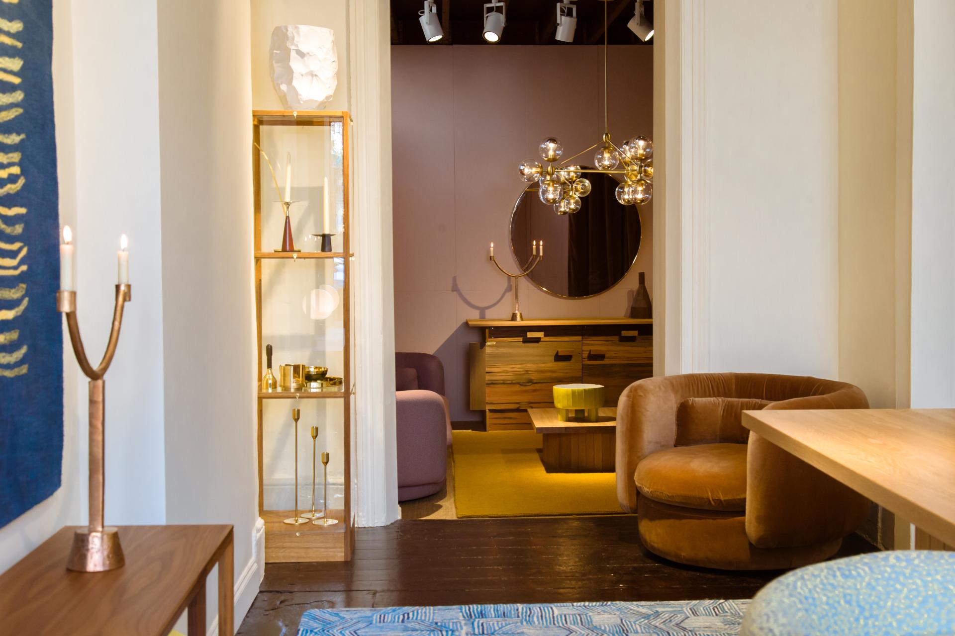 Elegant interior of SCP showroom on Pimlico Road, showcasing stylish furniture, a modern chandelier, and unique décor.