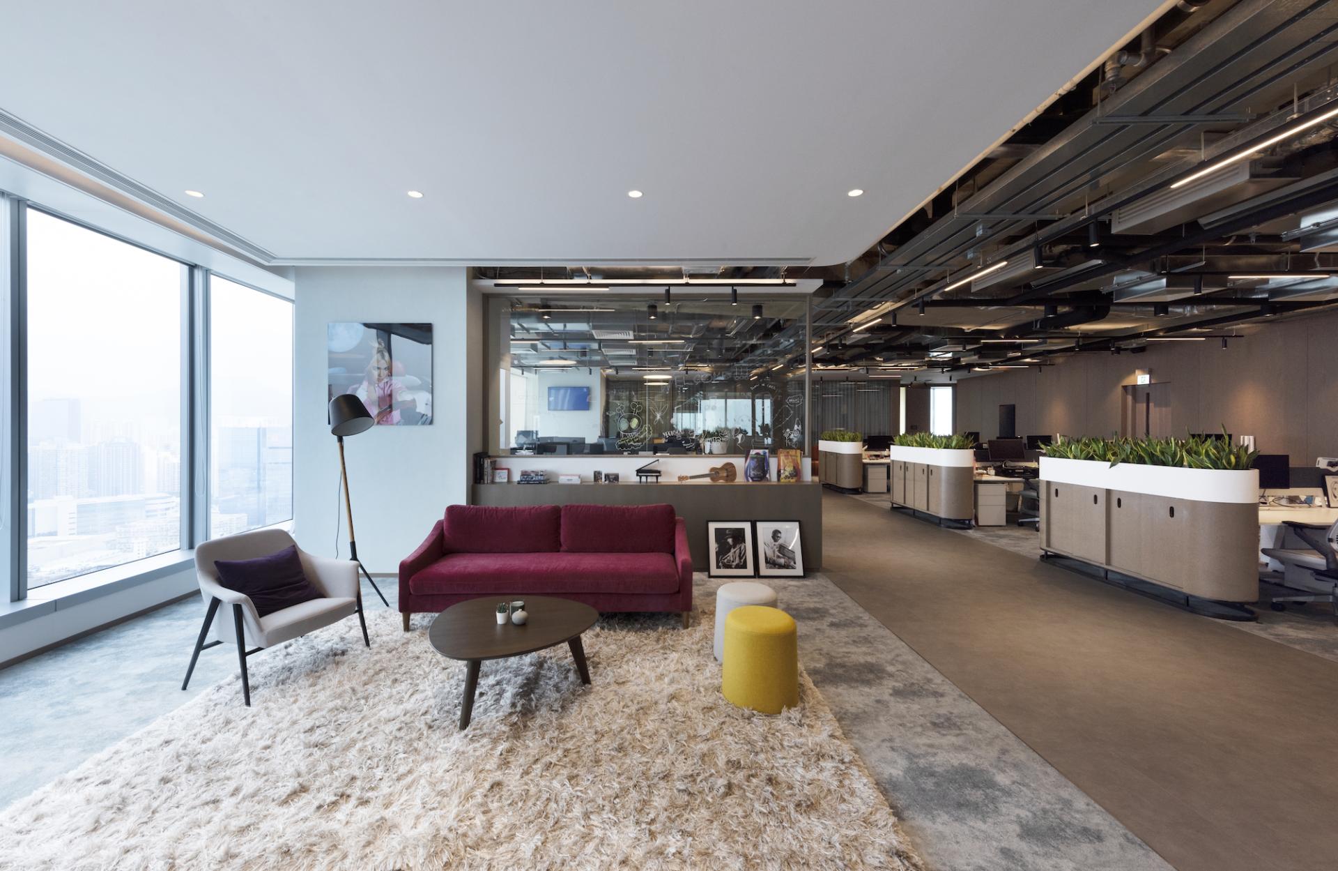 Modern office interior design by Bean Buro for Warner Music Hong Kong, featuring stylish seating and workspaces.