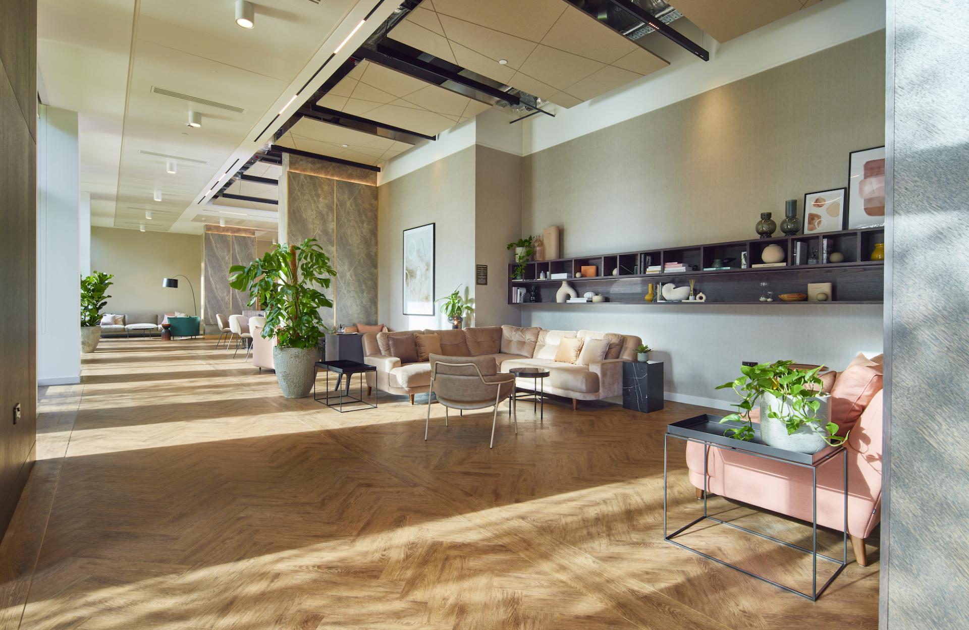 Modern residential amenity space designed by SpaceInvader, featuring stylish seating, greenery, and inviting decor overlooking the River Irwell.