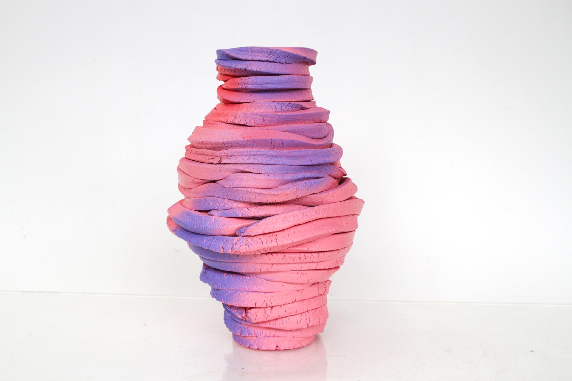 Colorful clay sculpture with swirling pink and purple layers, representing contemporary artisan creativity at London Craft Week 2024.