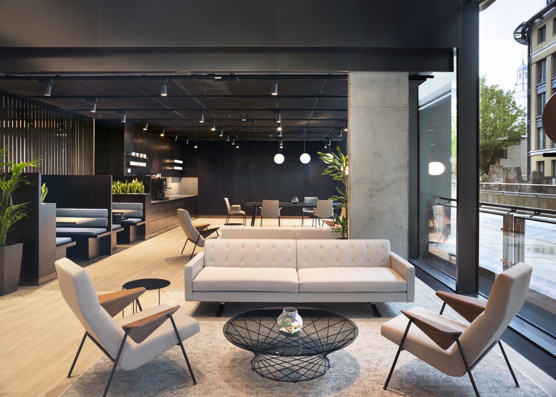 Modern office interior featuring a stylish lounge area, emphasizing collaboration and design, suitable for conversations at BDP.