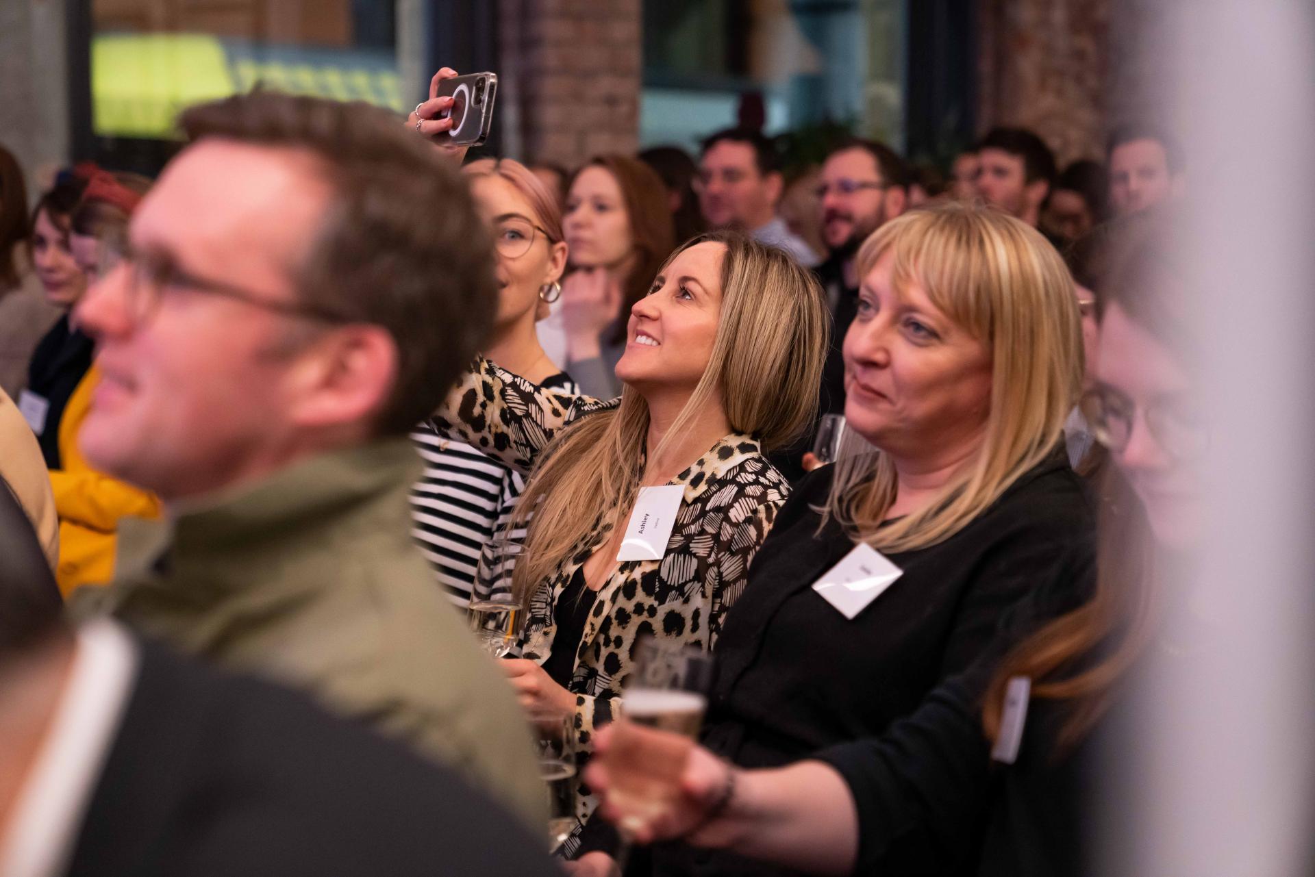 Attendees engaged and networking during the Material Source Studio sustainability seminar, capturing moments and sharing ideas.