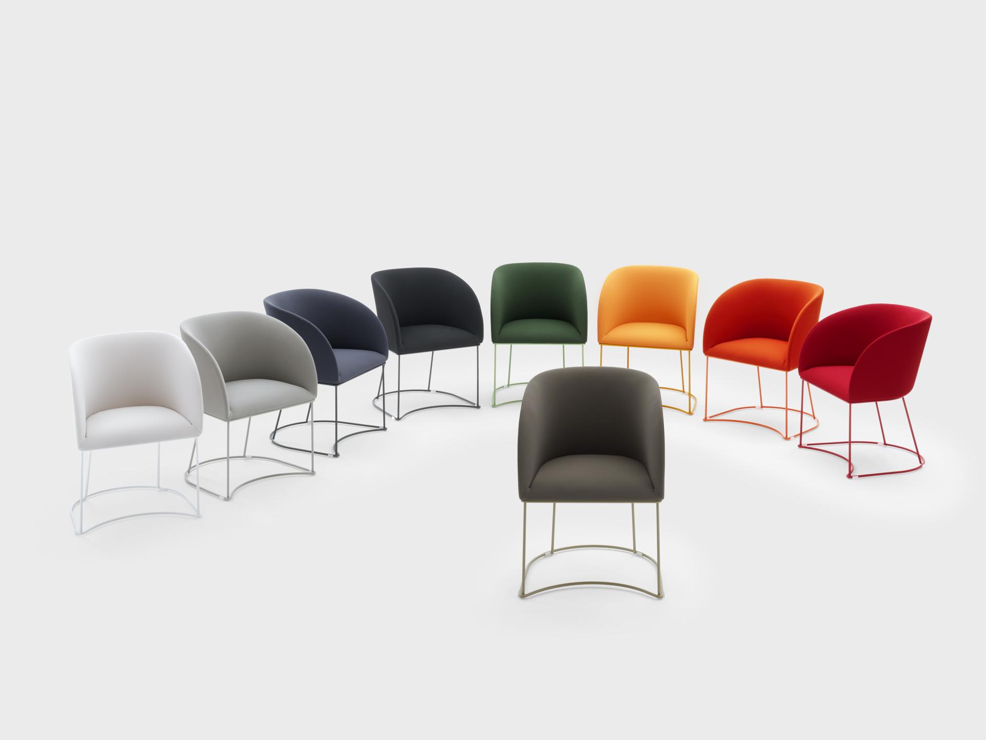 VIGANÒ & C. showcases a vibrant collection of modern upholstered chairs in various colors and sleek designs.