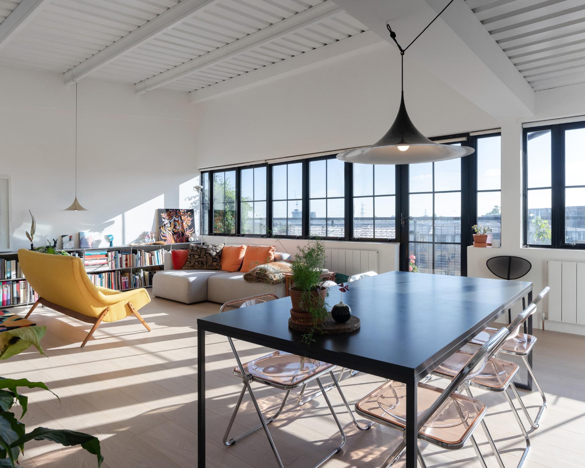 Bright and airy studio flat in Clapton, showcasing art deco design with contemporary furniture and large windows.