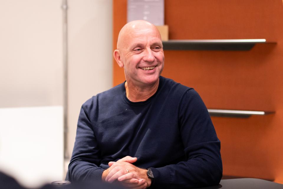 Nick Atkin, CEO of Yorkshire Housing, smiling during a meeting about the UK residential market.