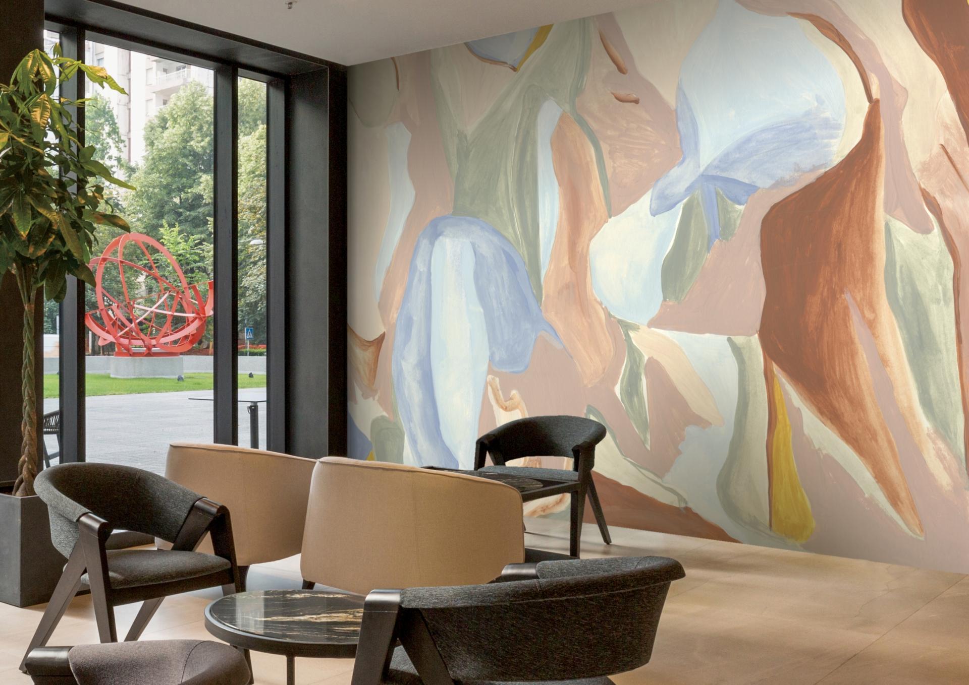 Vibrant mural by Jan Erika featuring organic shapes and soft colors, enhancing the modern interior space.