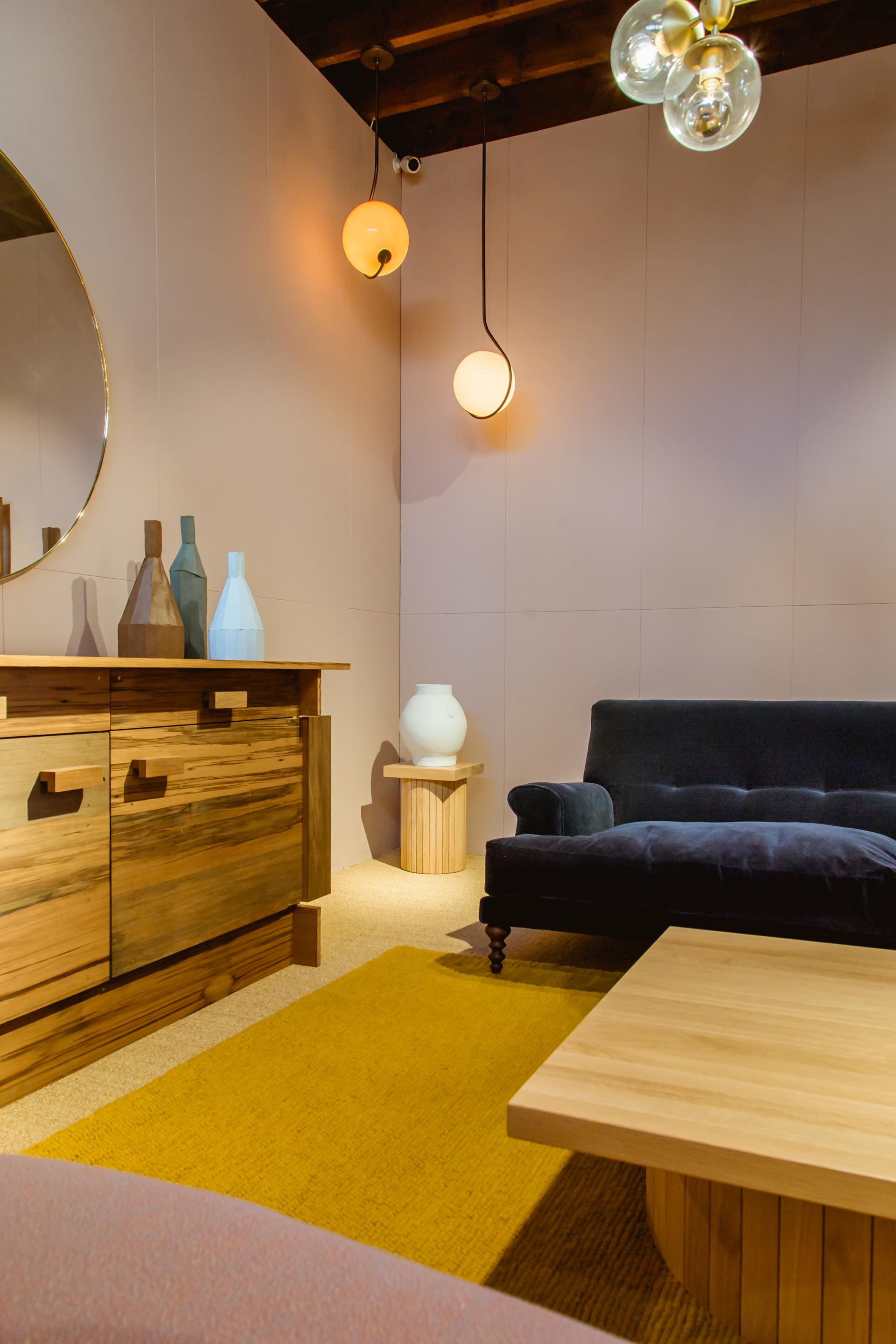 Stylish SCP showroom interior showcasing modern furniture, decorative vases, and elegant lighting in Grosvenor Estate, Belgravia.