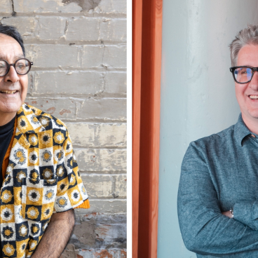 Atul Bansal and Richard Taylor posing casually in a dynamic Manchester studio, reflecting their creative collaboration.