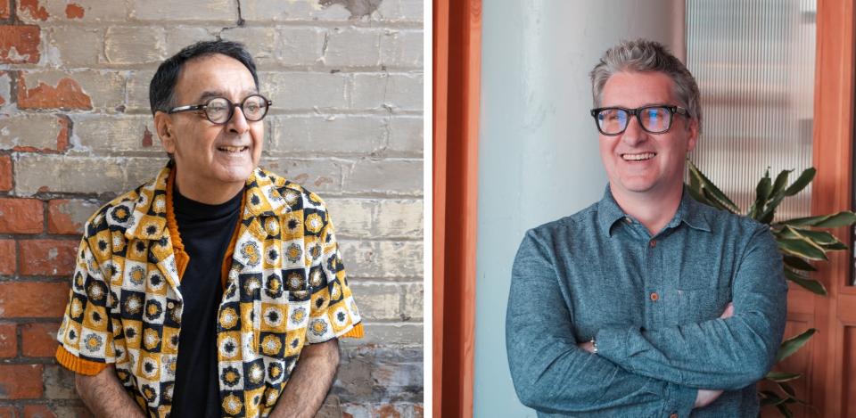 Atul Bansal and Richard Taylor posing casually in a dynamic Manchester studio, reflecting their creative collaboration.