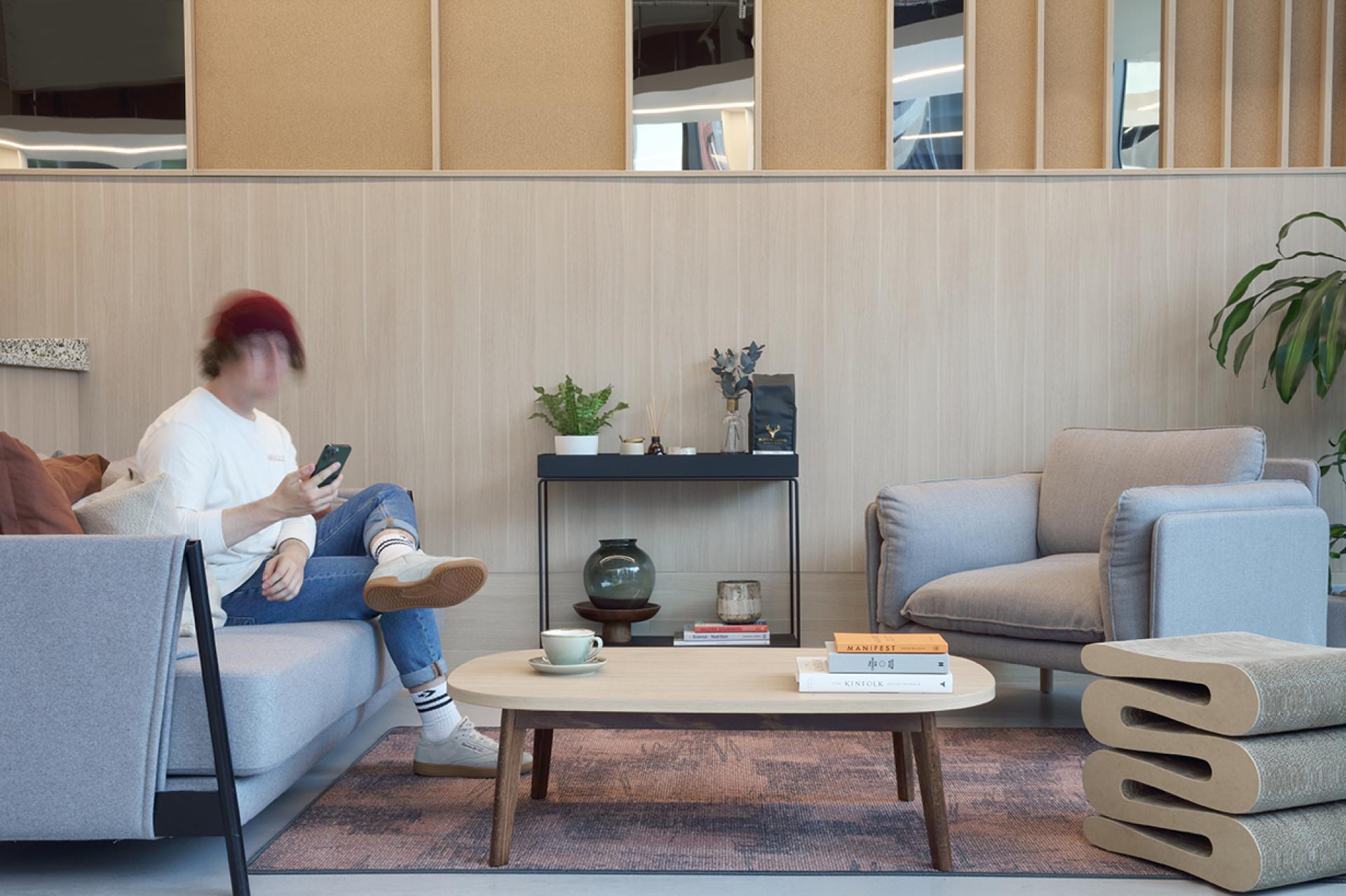 Modern social hub interior at Eden, New Bailey, featuring cozy seating and community-focused design elements.