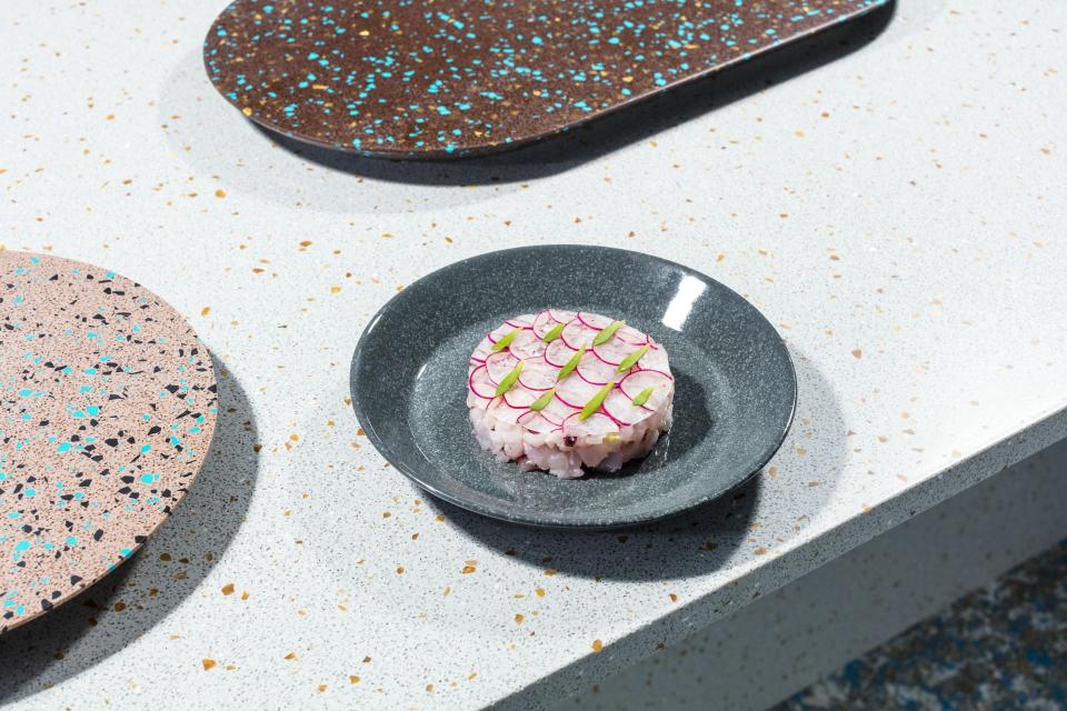 Elegant plate featuring a meticulously arranged dish, highlighting the sustainable culinary artistry of Linda Bergroth's Zero Waste Bistro.