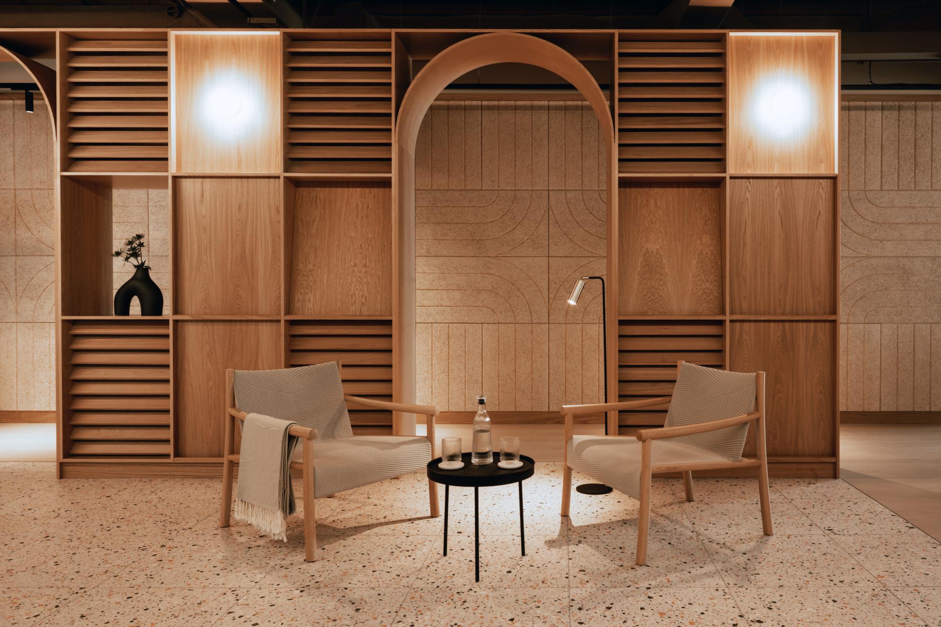 Modern workspace featuring stylish wooden shelving, minimalist seating, and elegant decor, reflecting Scotland's maker heritage in Edinburgh.