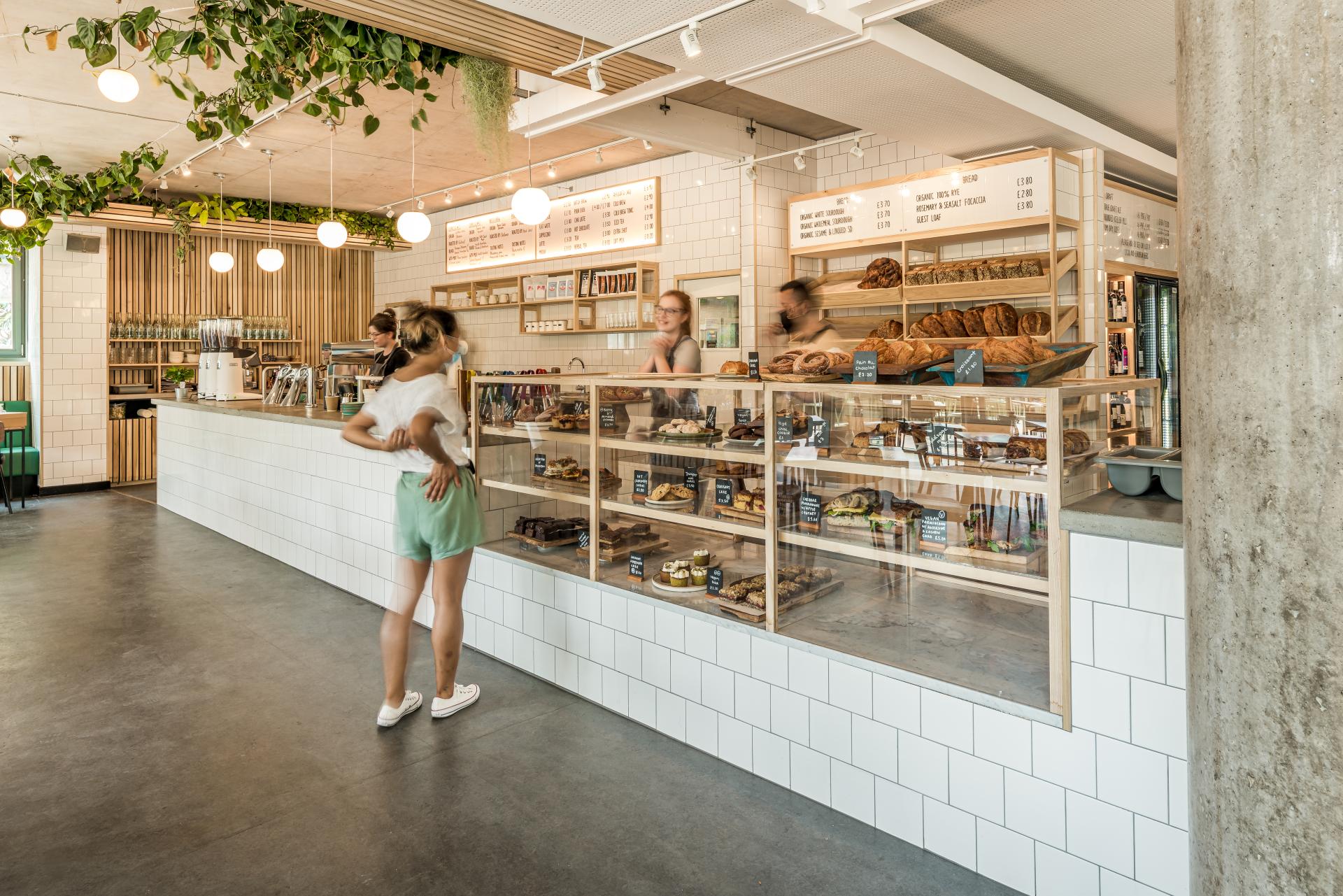 Bright bakery interior of Bristol Loaf, featuring a display of fresh pastries and a bustling café atmosphere.