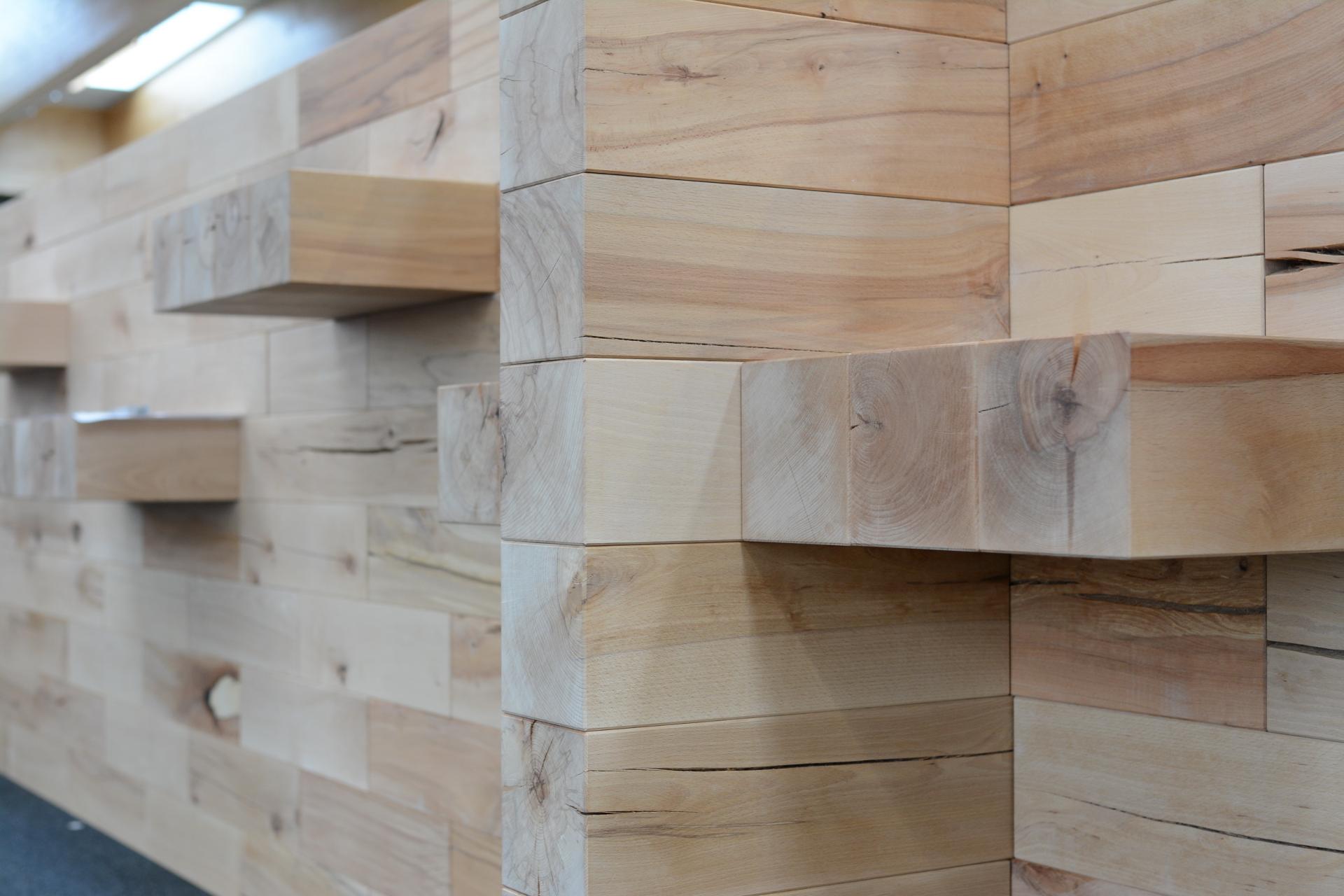 Modern wooden wall installation showcasing sustainable craftsmanship and natural wood grain, reflecting CRAFTWAND's commitment to versatility and eco-friendliness.