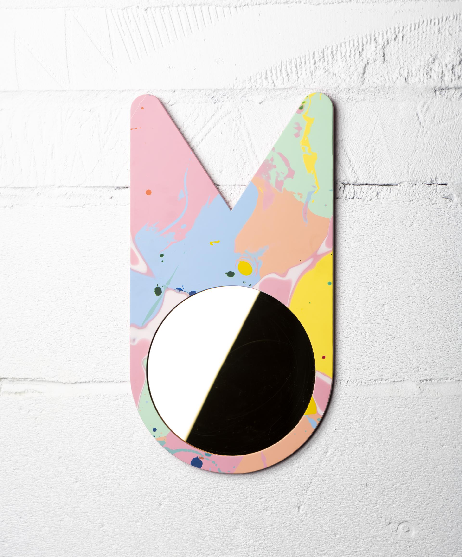 Colorful abstract wall-mounted mirror design by Mirrl, showcasing innovative surface design inspired by contemporary aesthetics.
