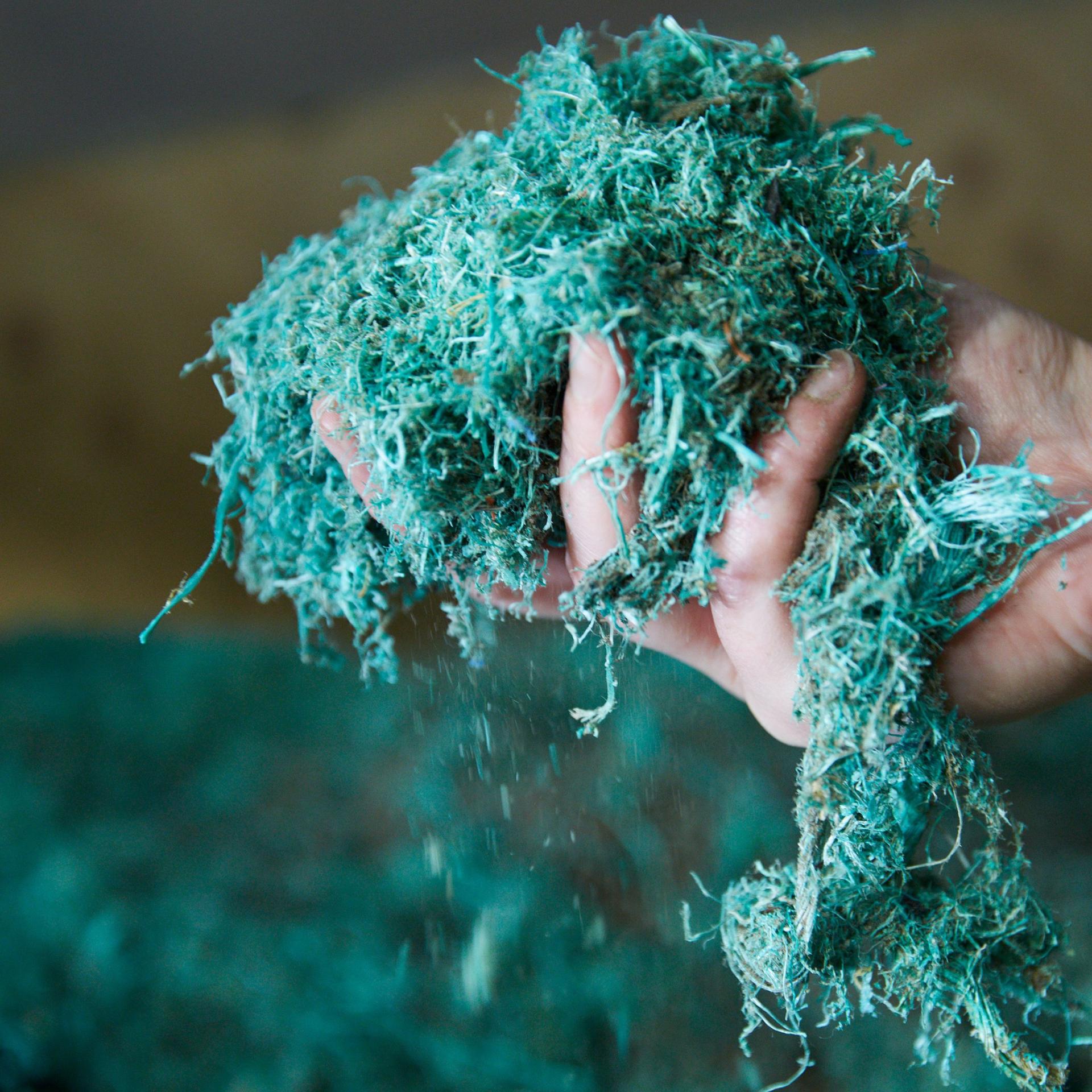 Sustainable design material being held, showcasing the eco-friendly components of Mater's Ocean Collection by Ditzel.