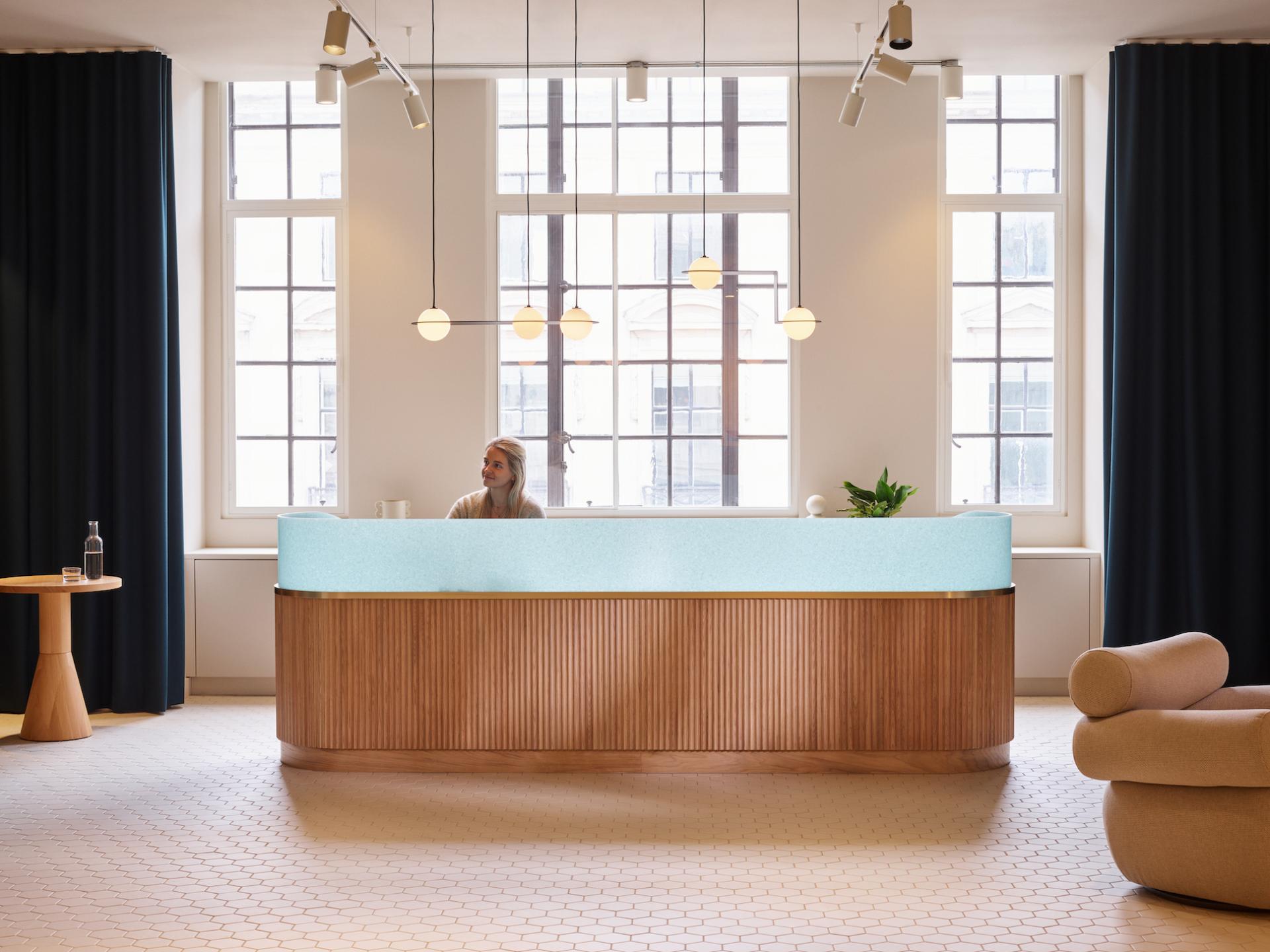 Modern reception area of Liberty House, featuring a stylish desk, natural lighting, and contemporary decor in London's West End.