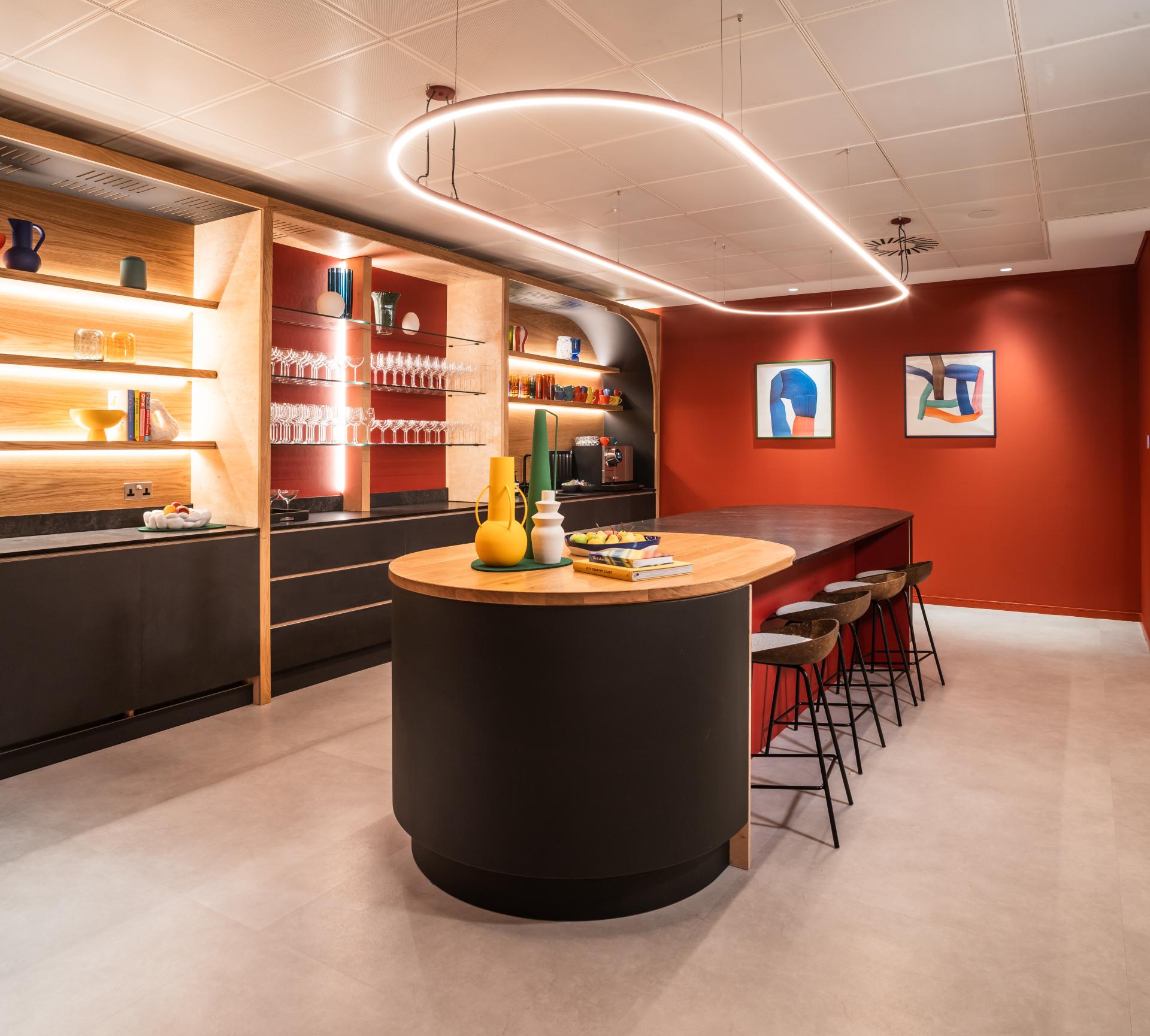 Stylish kitchen interior with modern design elements, vibrant colors, and warm lighting, enhancing Scotland's built environment experience.