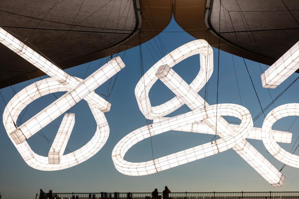 Sculptural light installation by Studio Mieke Meijer, featuring oversized luminous designs suspended at Coal Drops Yard.