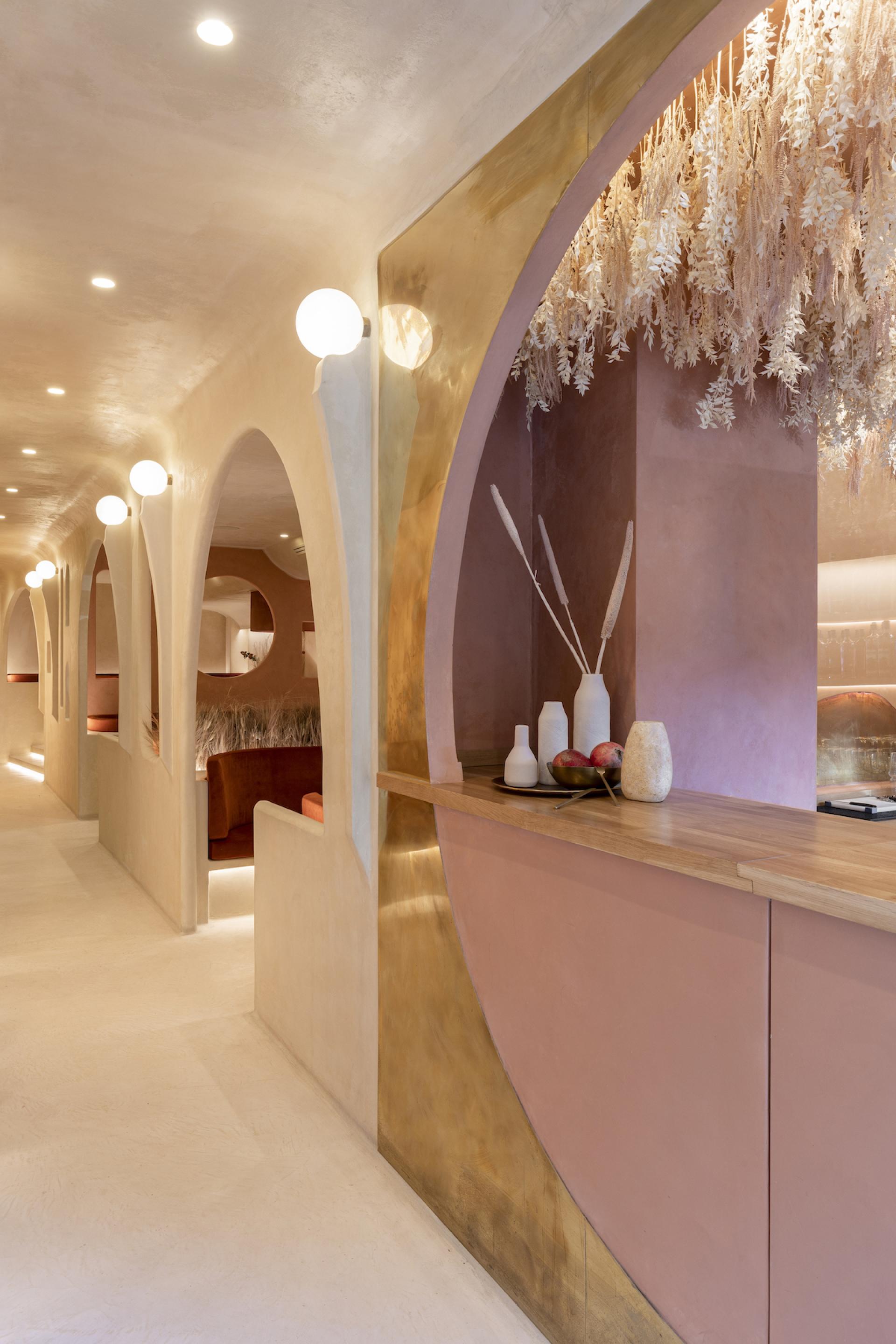 Interior view of Living Bakkali restaurant, showcasing Middle Eastern design elements with soft lighting and elegant decor.