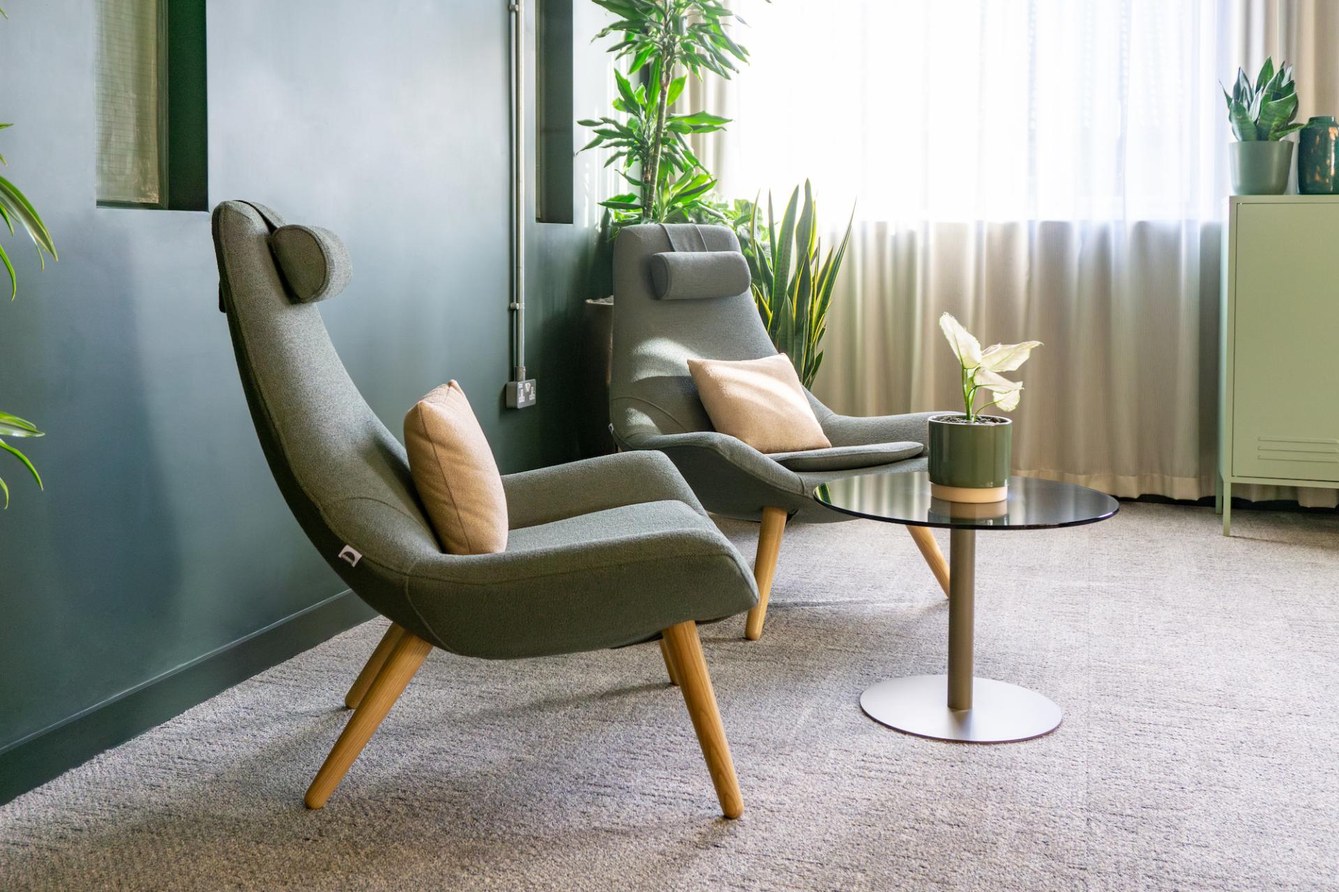 Stylish seating area in the Liz Hickson Academy, promoting collaboration and wellbeing with plants and soft furnishings.