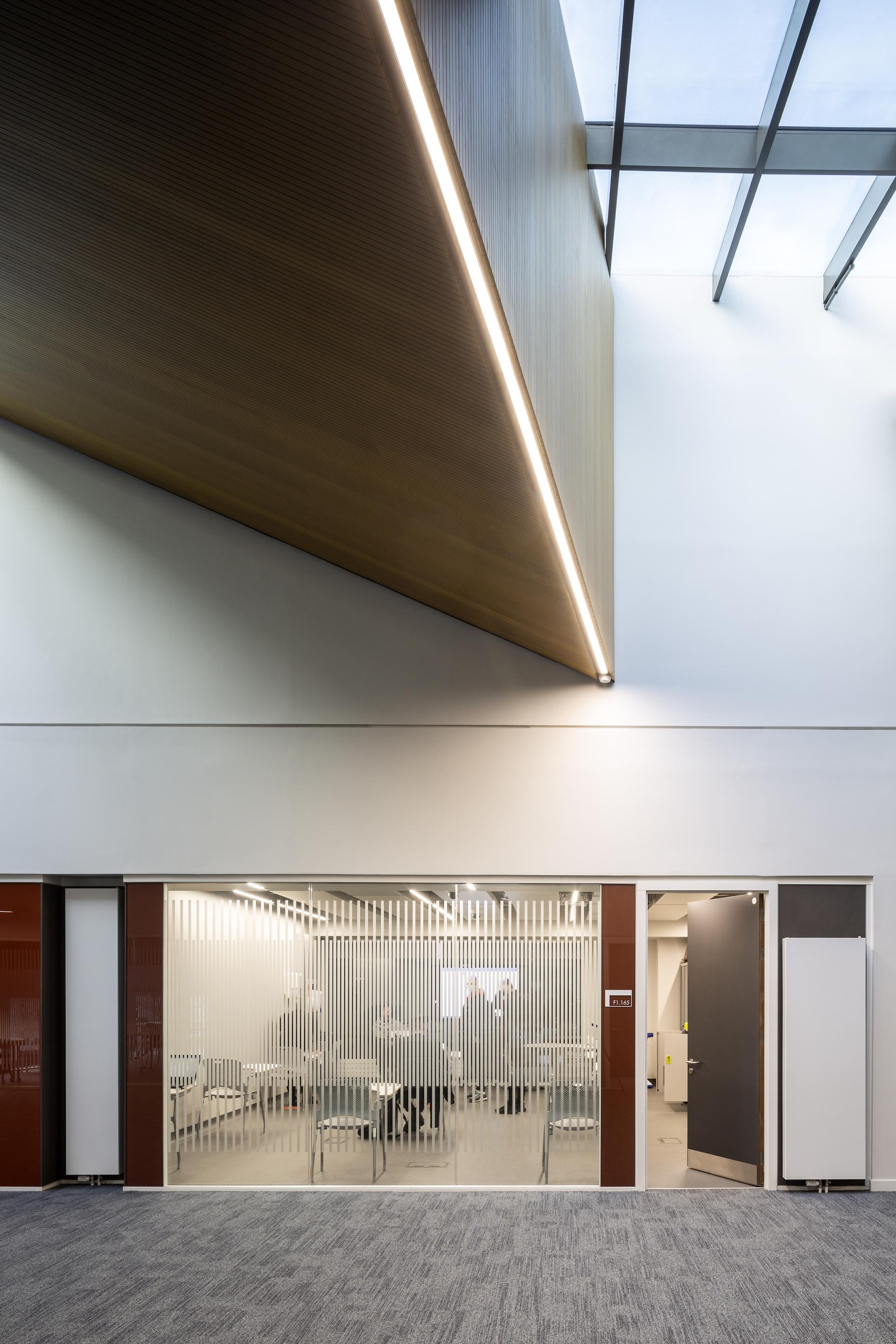 Modern architectural interior showcasing a conference room with sleek design and glass partitions, part of the RIBA Stirling Prize shortlist.