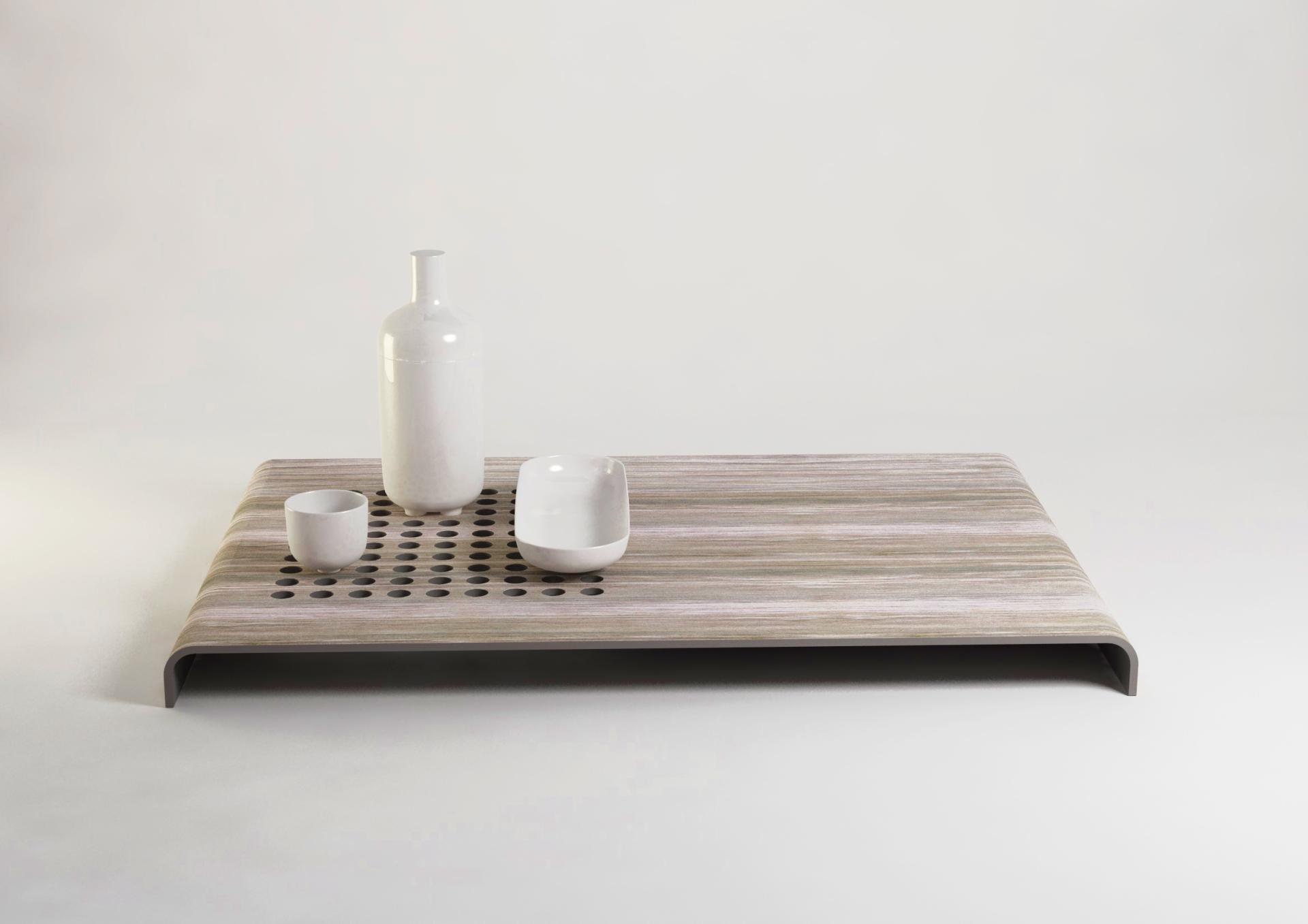Stylish table made from recycled banana plant trunks, featuring ceramic vessels, showcasing sustainable design by FIBandCO.