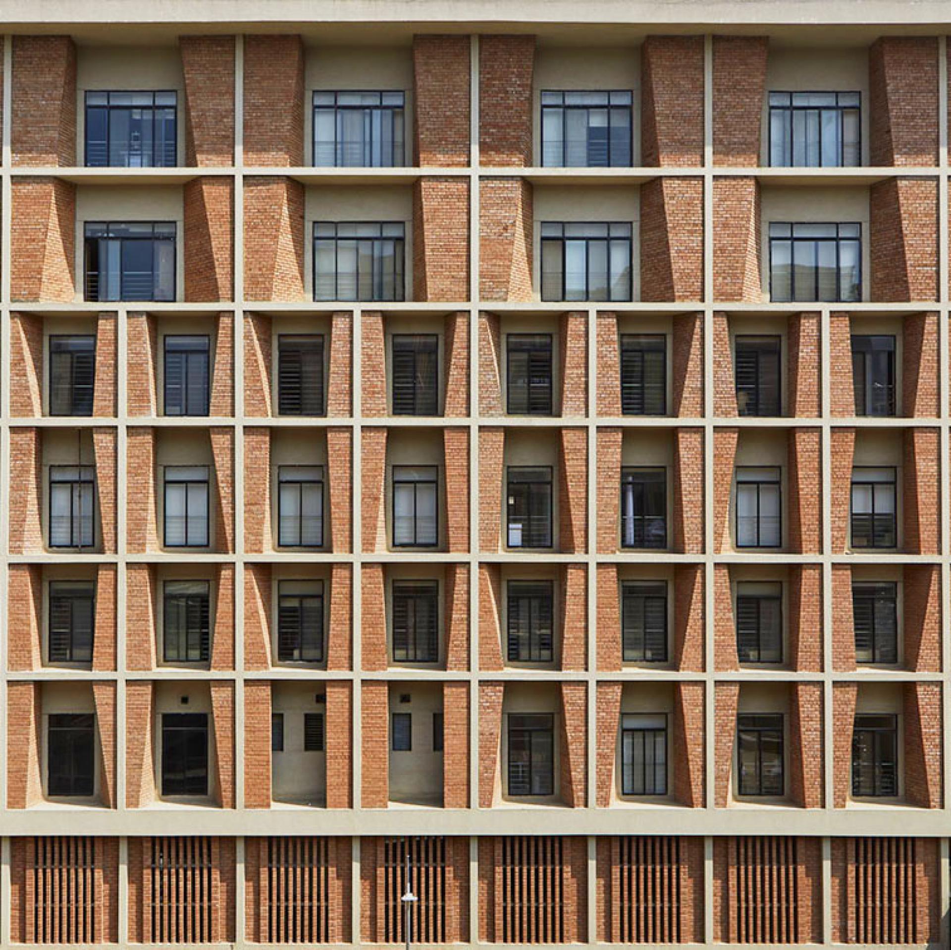 Contemporary façade of Symbiosis University Hospital showcasing innovative brickwork and architectural design by IMK Architects in Pune.