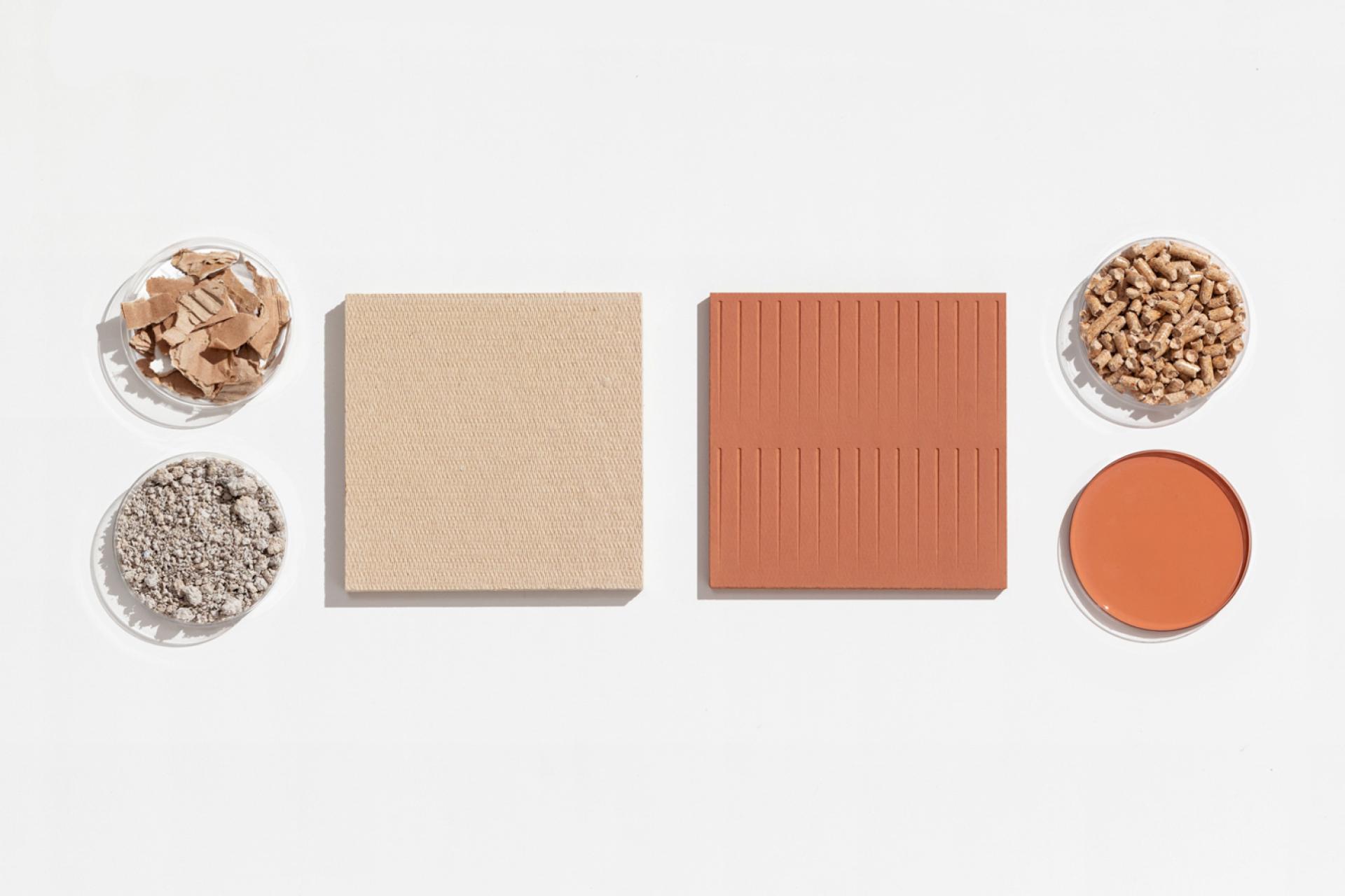 Biomaterial samples are displayed, including textured panels and organic materials, highlighting low-carbon and waste-based products for sustainable design.