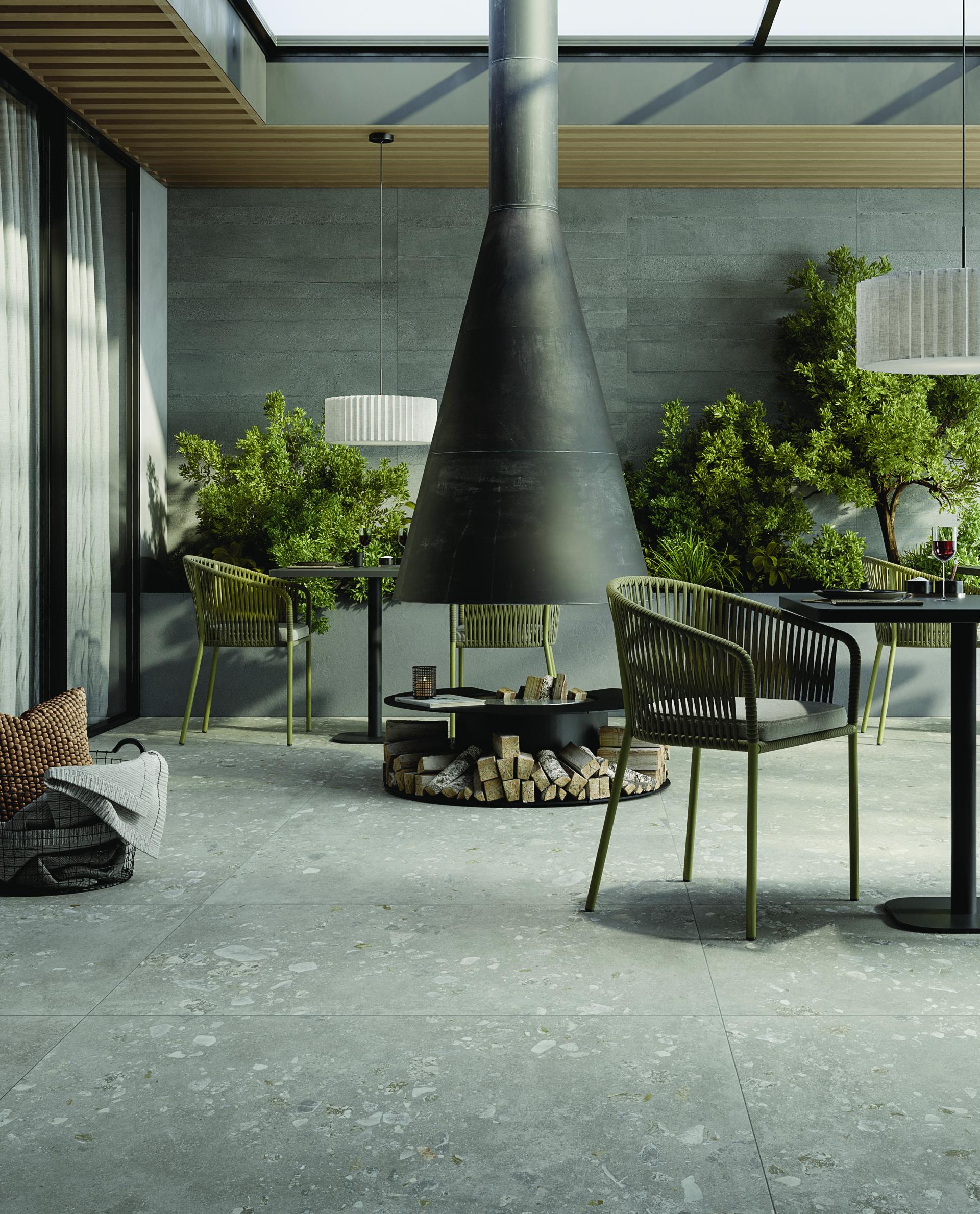 Stylish outdoor patio featuring Grestec's Atacama porcelain tiles, modern furniture, and lush greenery for a Nordic-inspired aesthetic.