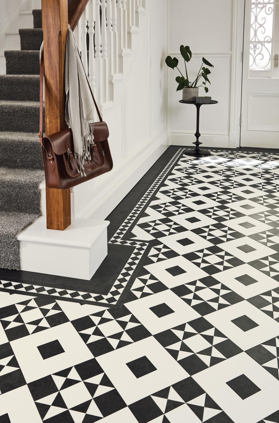 Heritage-style black and white patterned flooring in a modern interior, featuring Victorian and Regency design influences.