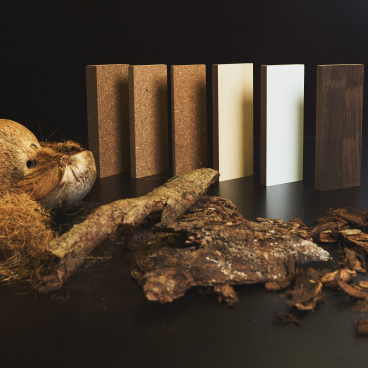 Coconut materials and sustainable biocomposite panels displayed together, showcasing innovative coconut-based products by NaturLoop.