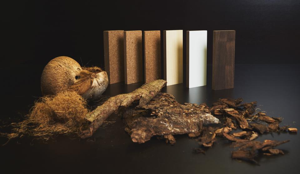 Coconut materials and sustainable biocomposite panels displayed together, showcasing innovative coconut-based products by NaturLoop.