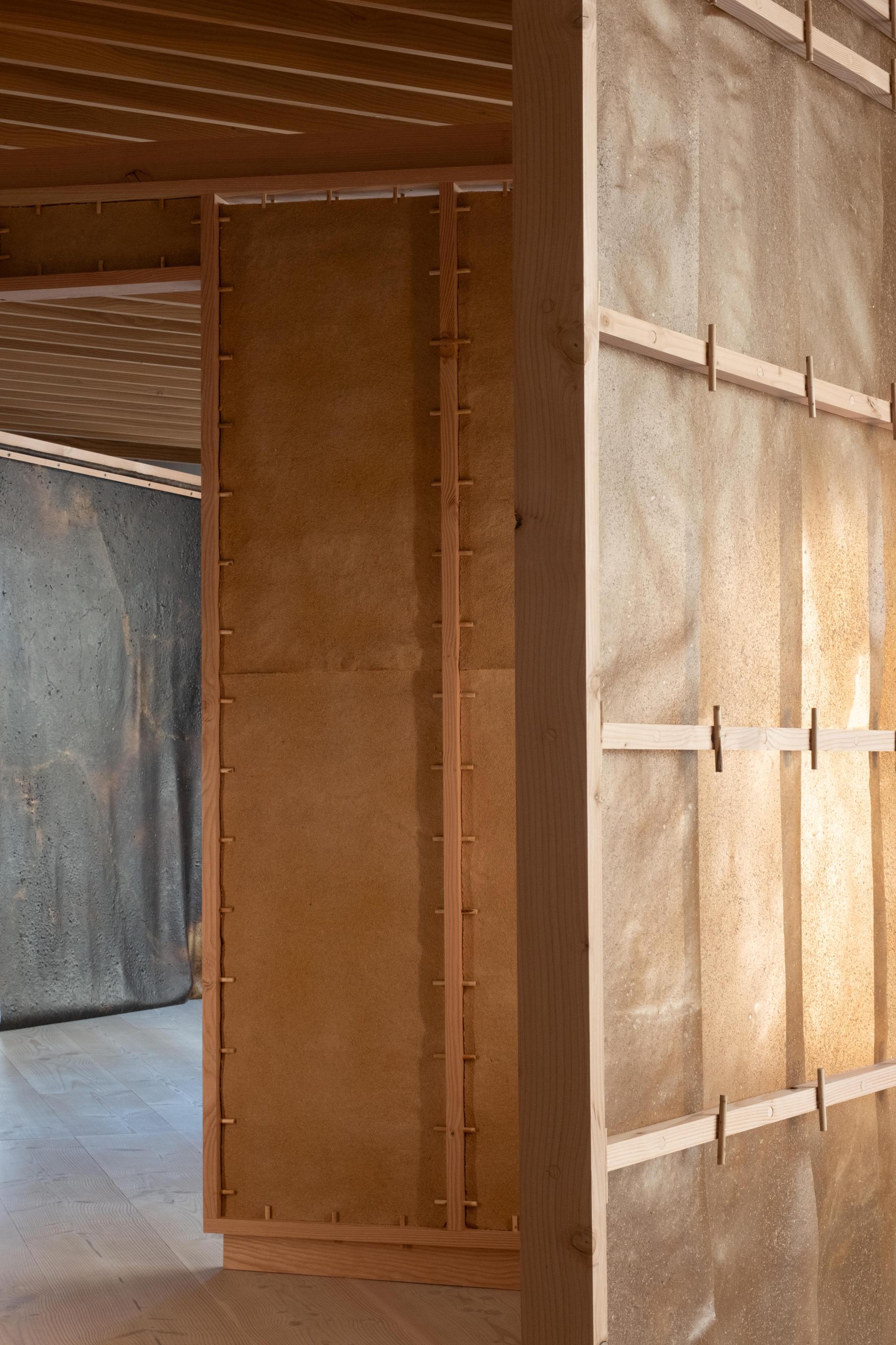 Interior view of SMULD installation showcasing innovative use of wood and natural materials in architecture.