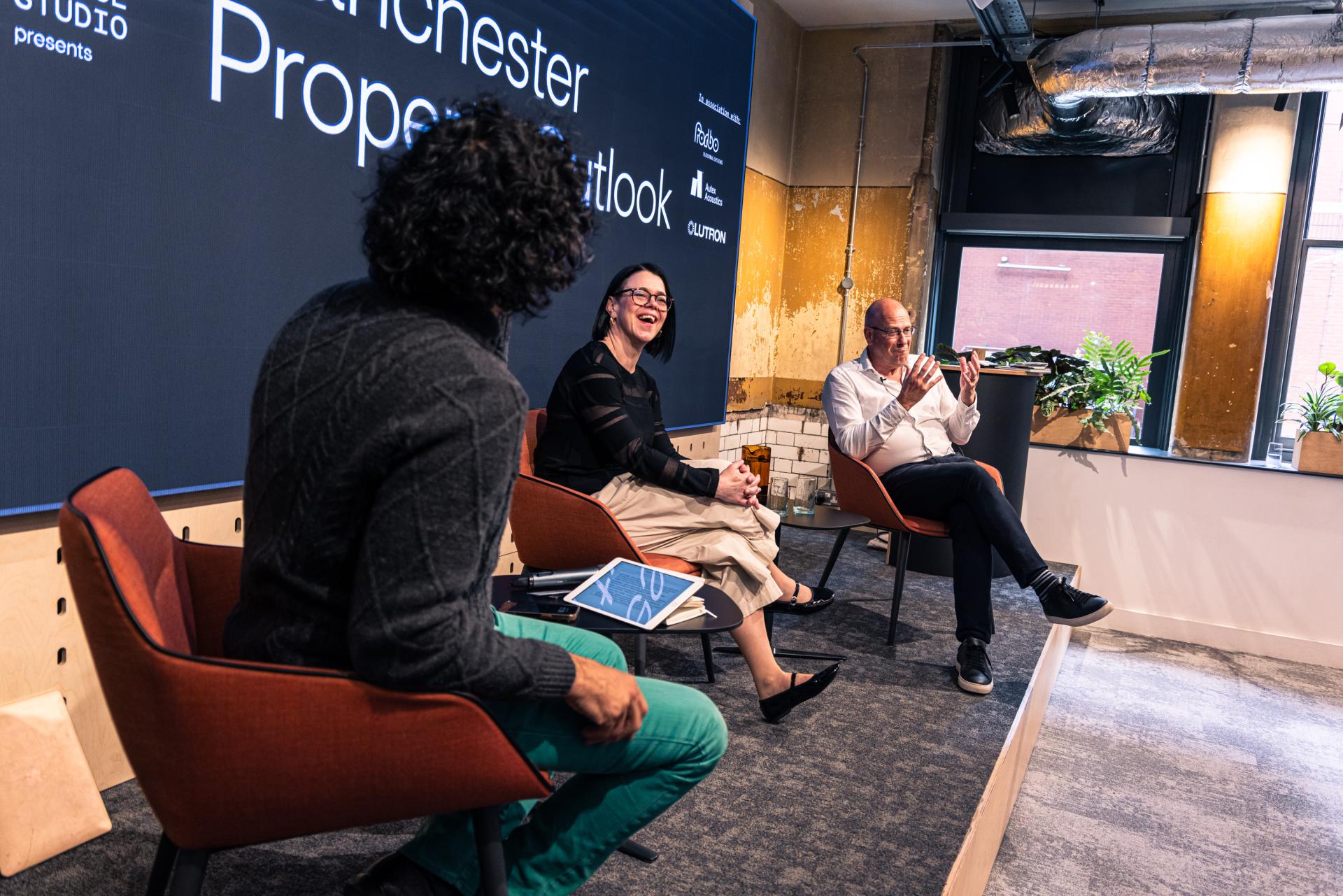 Panel discussion at Manchester Property Outlook seminar, featuring industry experts discussing growth drivers in Manchester's property market.