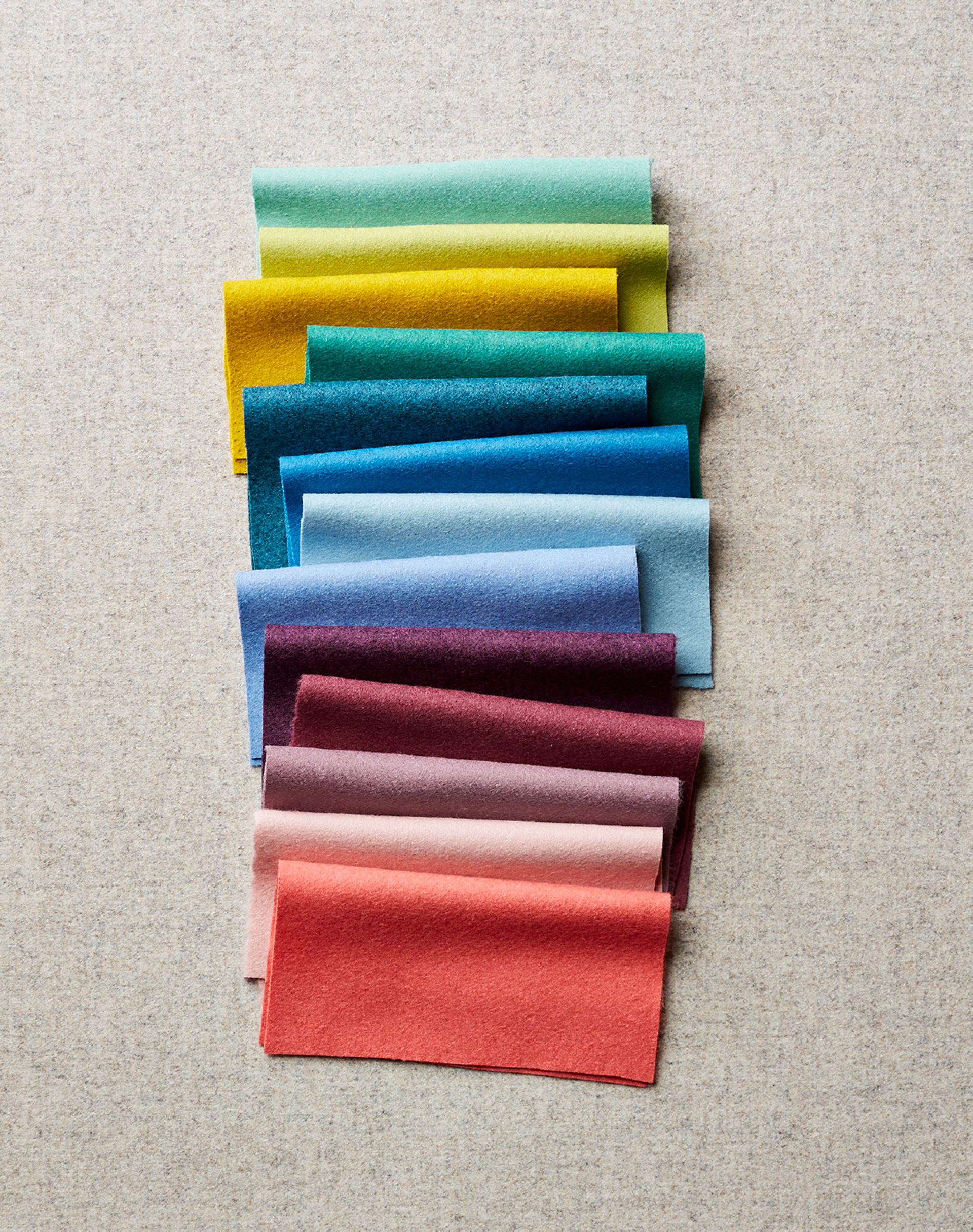 Vibrant fabric samples in assorted colors showcasing Camira's StaySafe textile treatment for enhanced safety and protection.