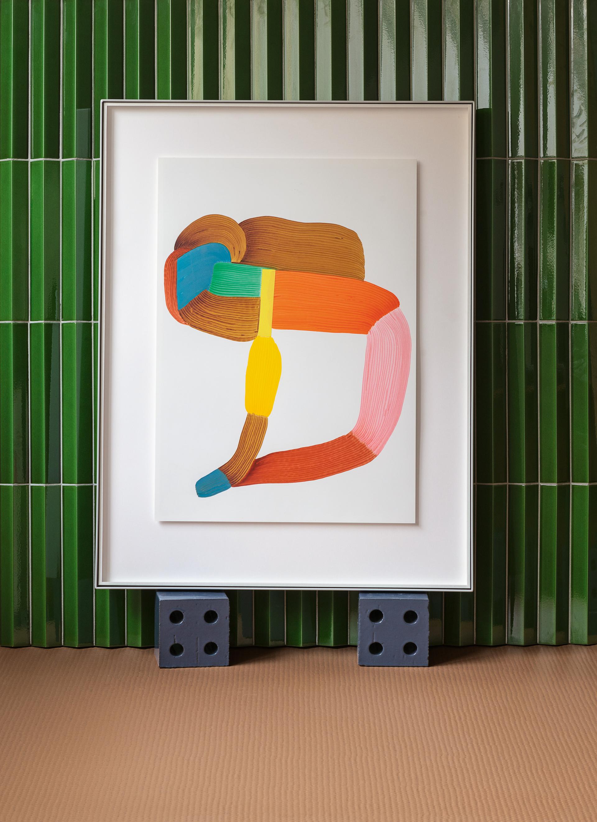 Colorful abstract artwork displayed in a modern space, highlighting the collaboration between Mutina and Studio Bouroullec.