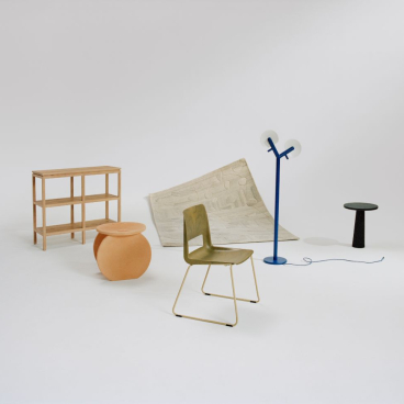 Contemporary Norwegian furniture and decor showcasing circular design elements in a minimalist setting.