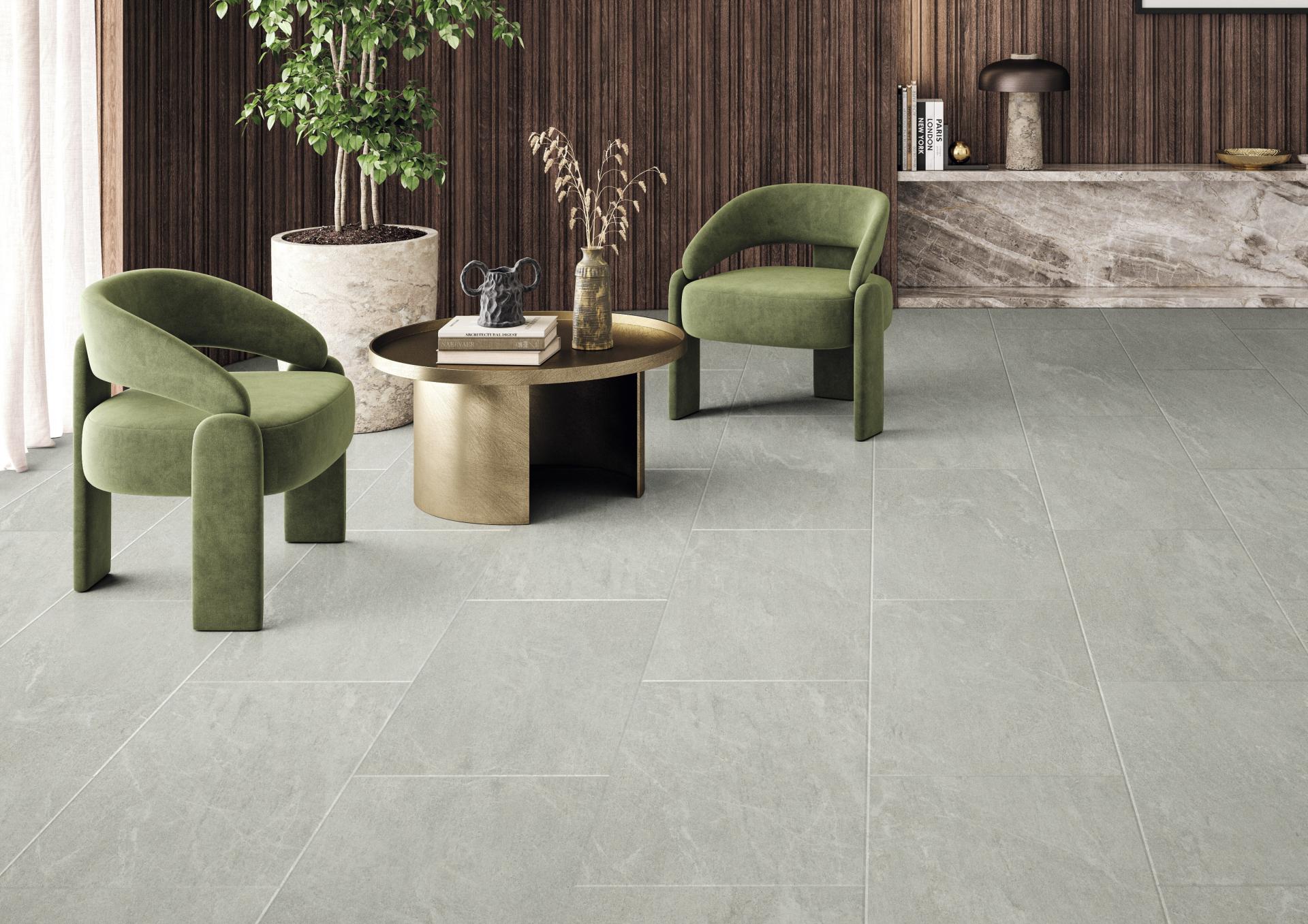 Stylish green chairs and a round coffee table in a modern, sustainable residential interior setting.