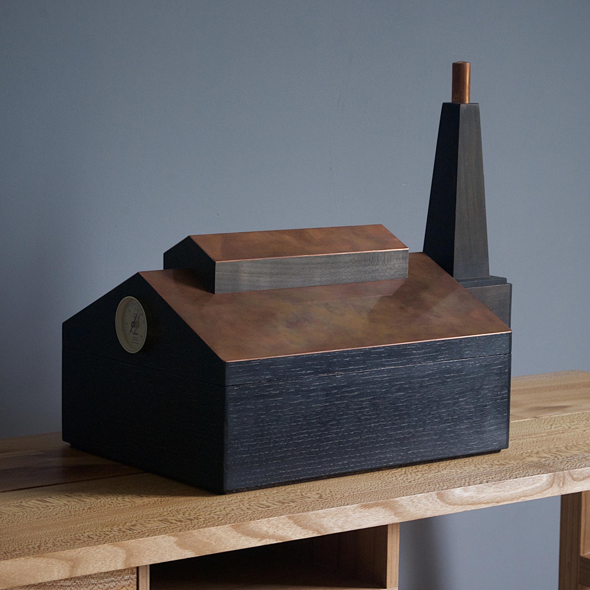 Contemporary wooden box with copper accents, showcasing sustainable design and craftsmanship by furniture maker Sand Buchanan.