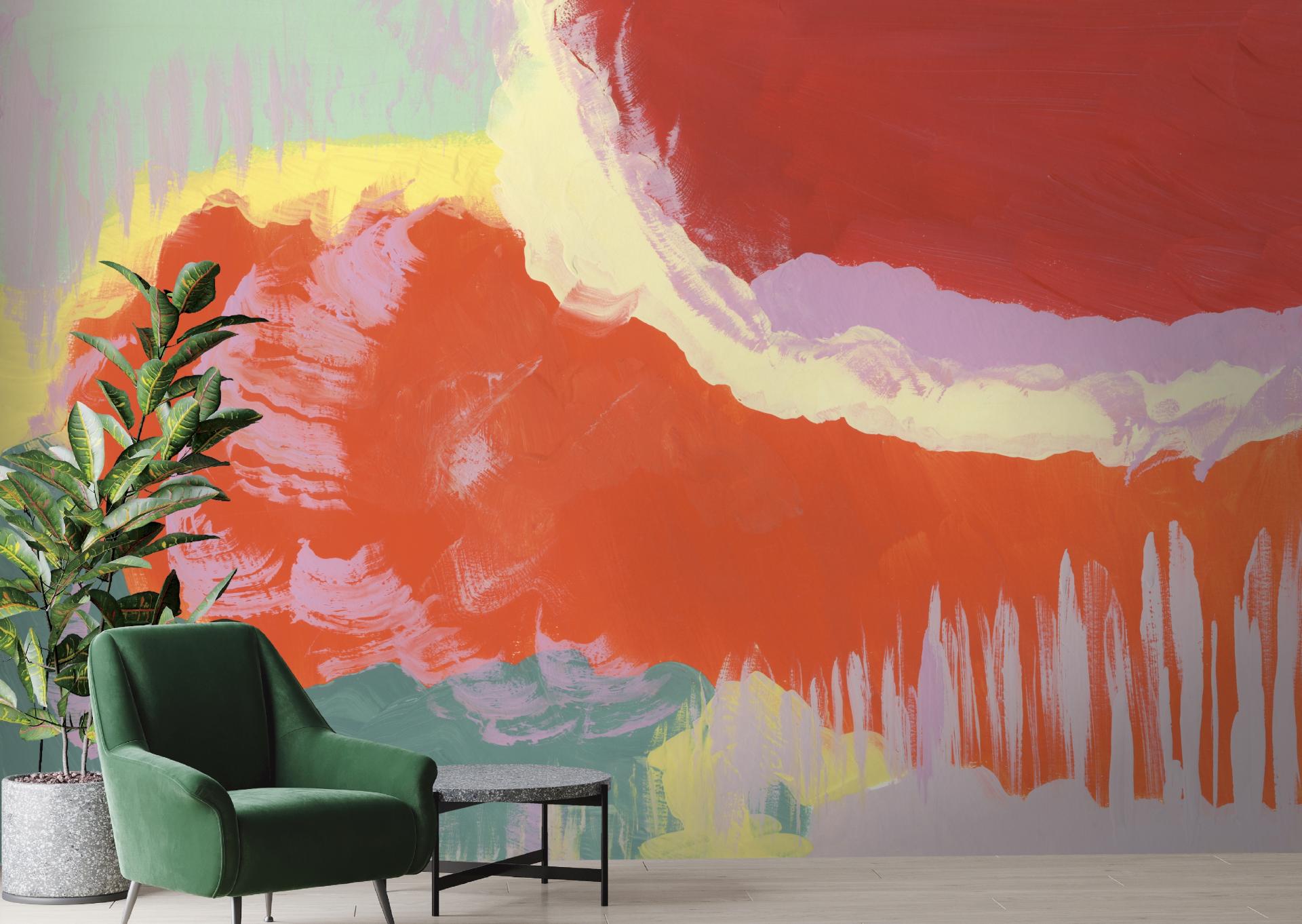 Vibrant mural by Jan Erika featuring organic shapes and colors, complemented by a stylish green chair and indoor plant.