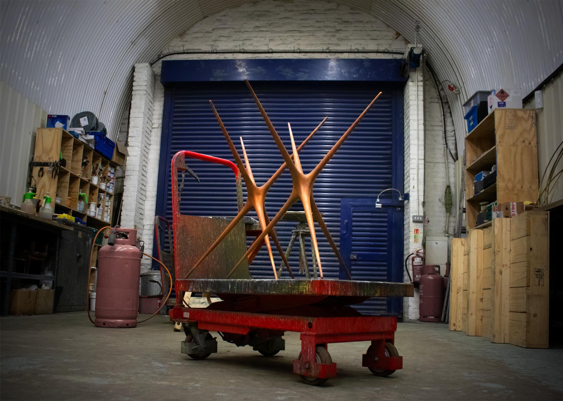 Brodie Neill's reimagined Supernova trestle displayed on a workshop cart, showcasing its unique design and craftsmanship.
