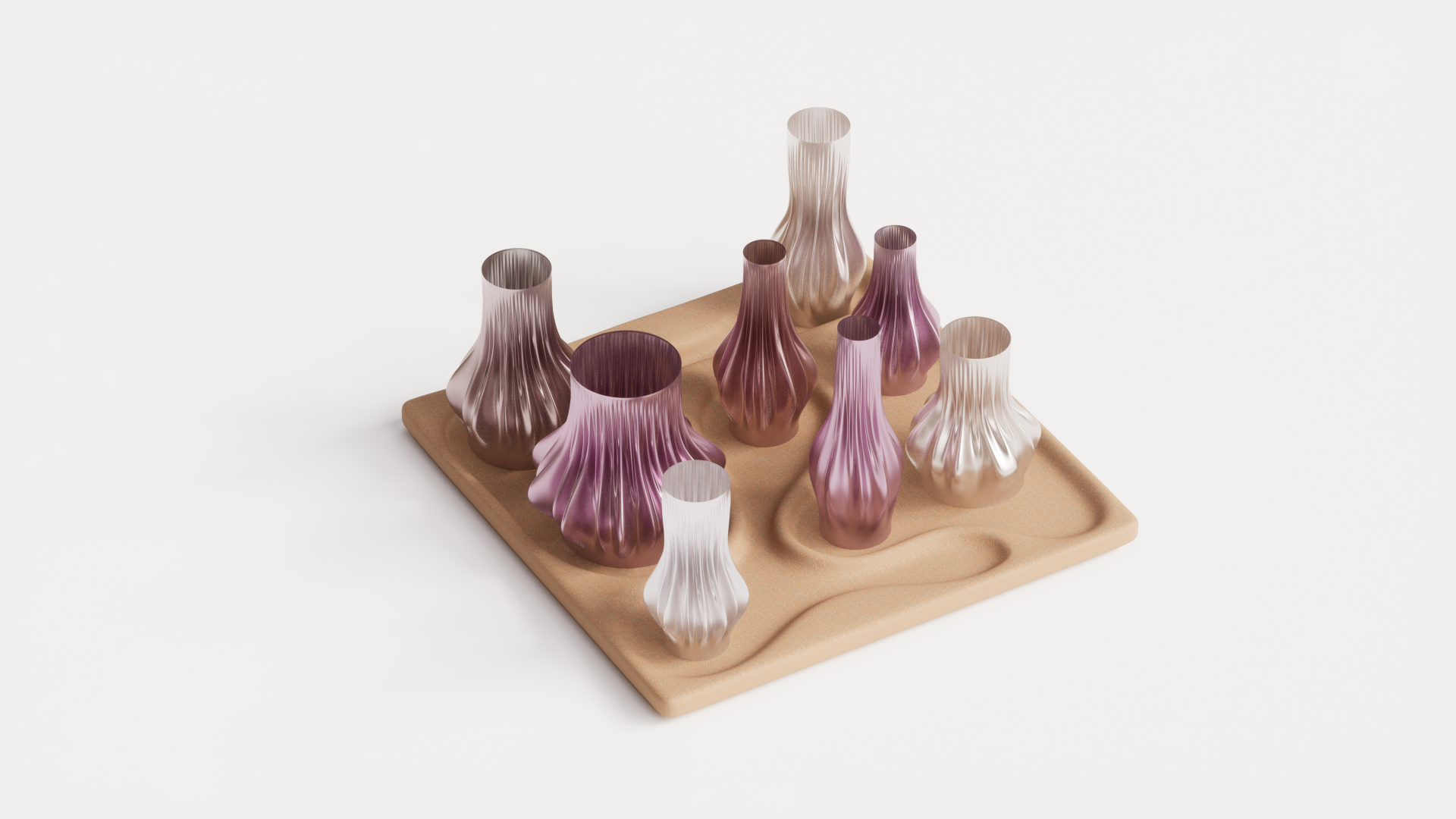 Colorful 3D-printed vases of various shapes displayed on a textured, sandy base, showcasing innovative design in print technology.