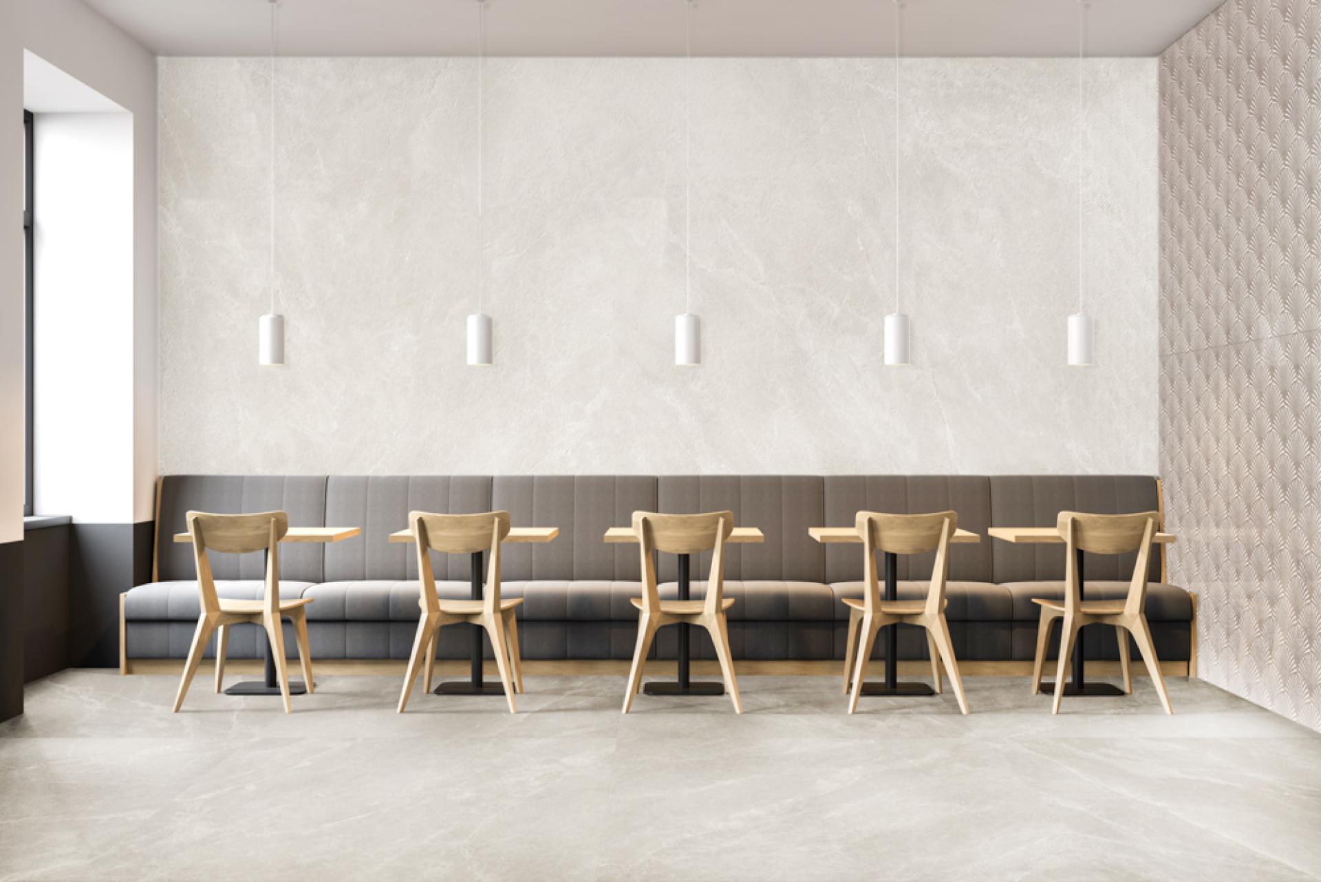 Modern café interior featuring stylish ceramic tiles, wooden furniture, and elegant lighting, showcasing contemporary tile design trends.