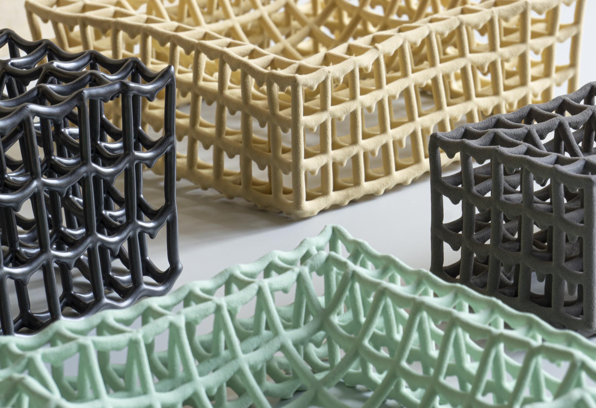 Stylish, laser-etched ceramic baskets in various colors showcasing innovative Dutch design techniques at Dutch Design Week 2024.