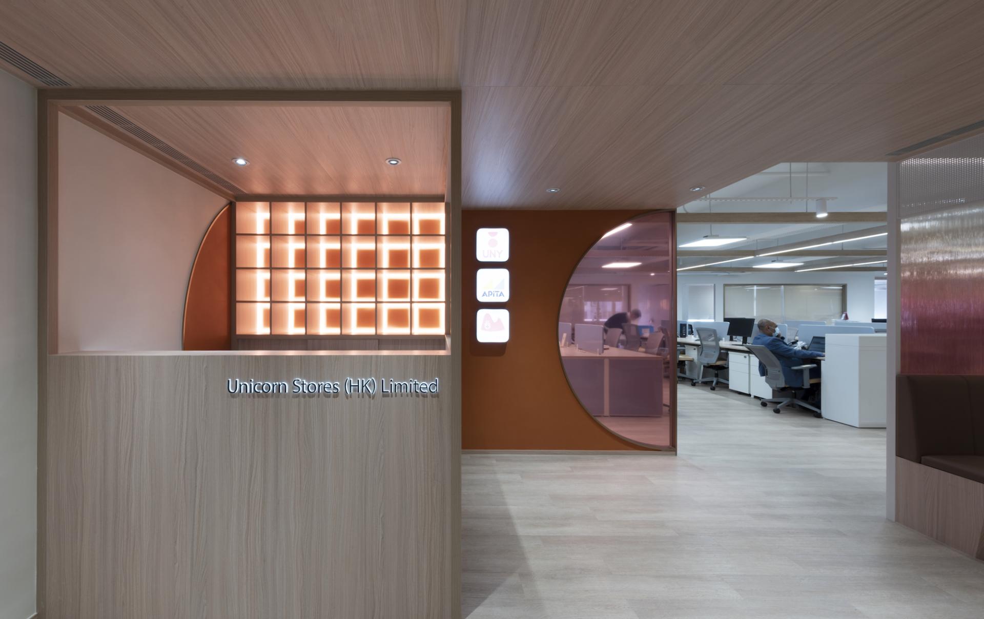 Modern reception area of Unicorn Stores (HK) Limited showcasing elegant design and workspace for employees.