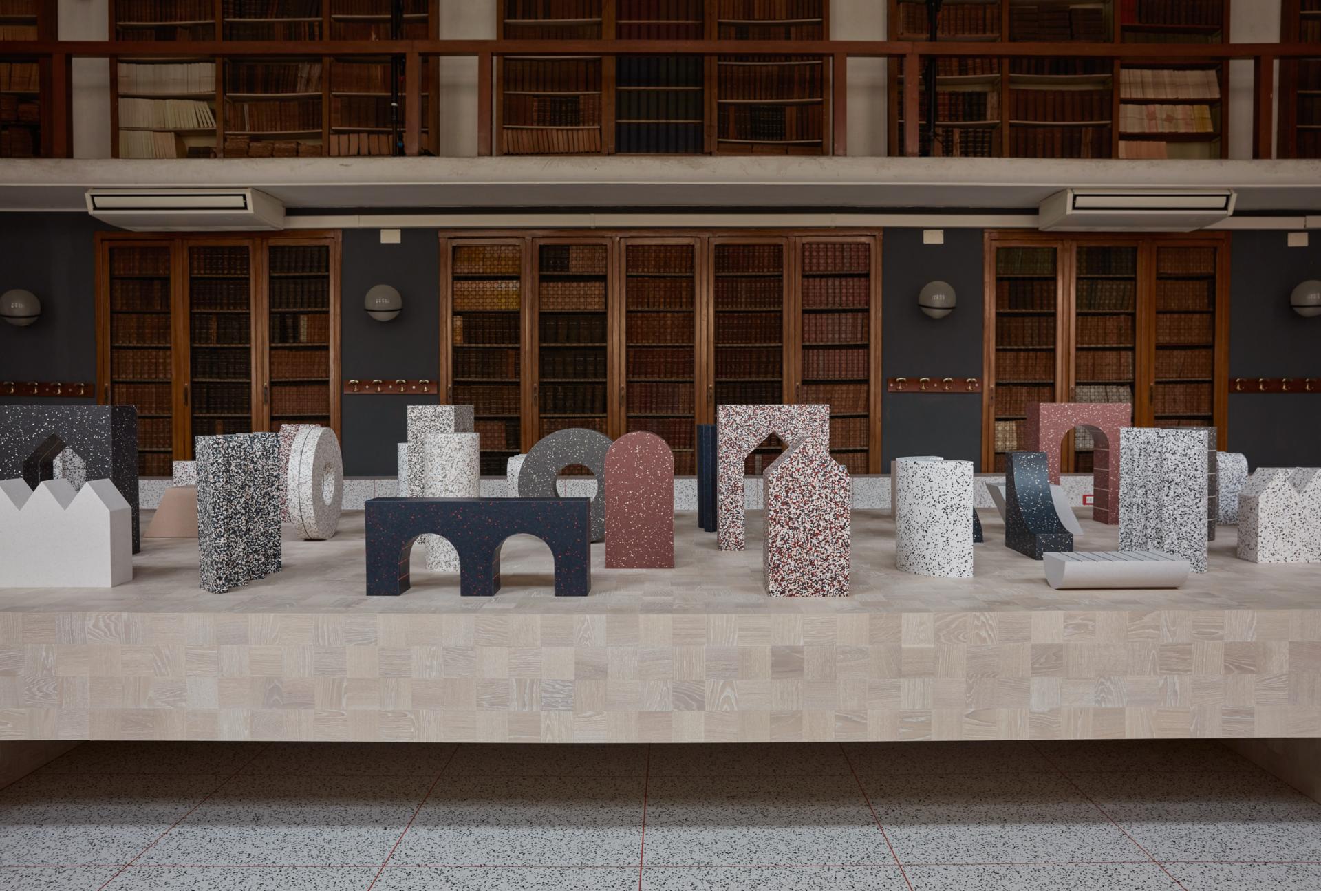 Colorful geometric sculptures showcased at Milan Design Week, reflecting Tarkett's innovative design and material creativity.