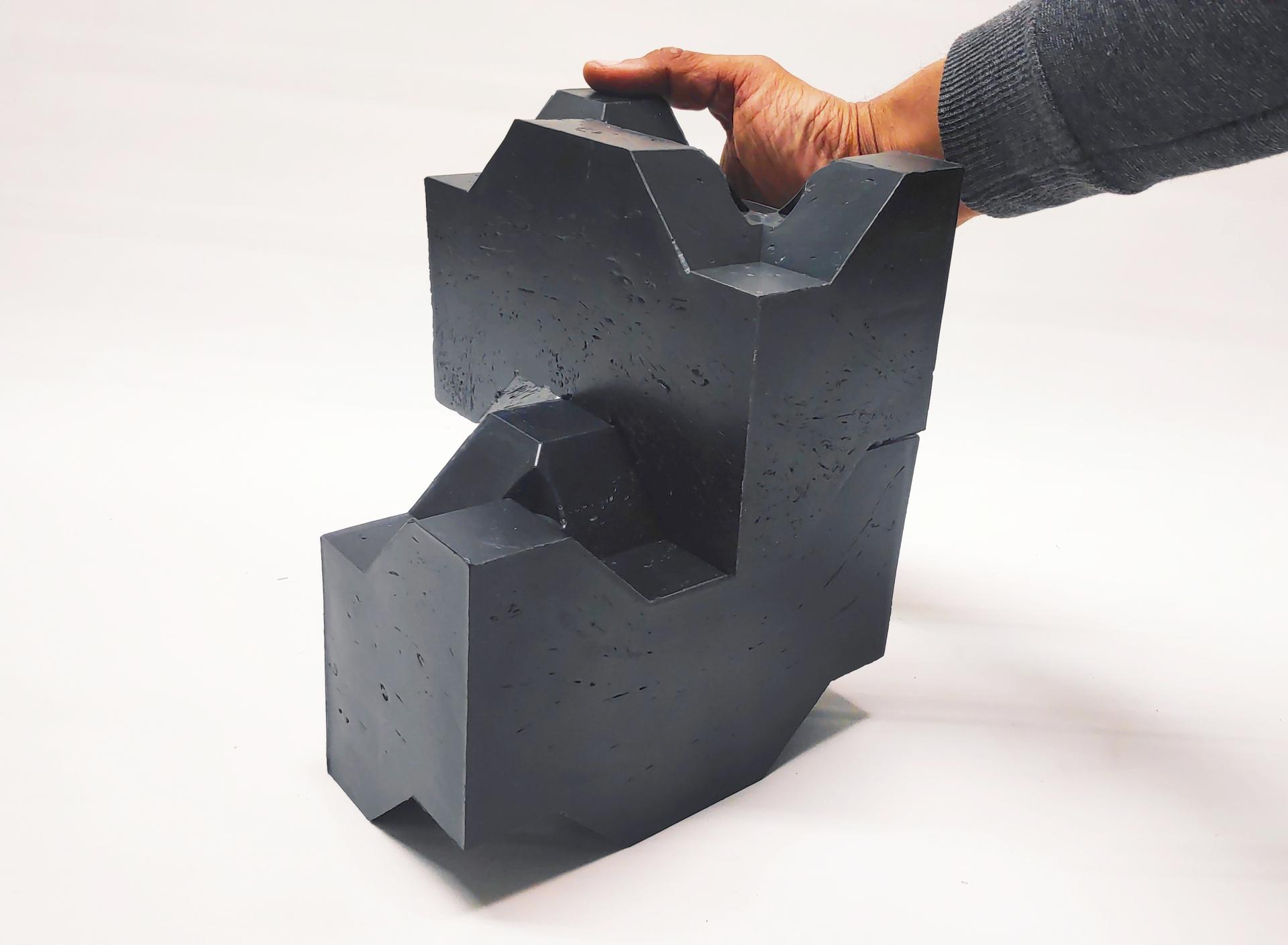 Plastic waste sculpture exemplifying sustainable design and circular economy principles, highlighting innovative solutions for affordable housing.