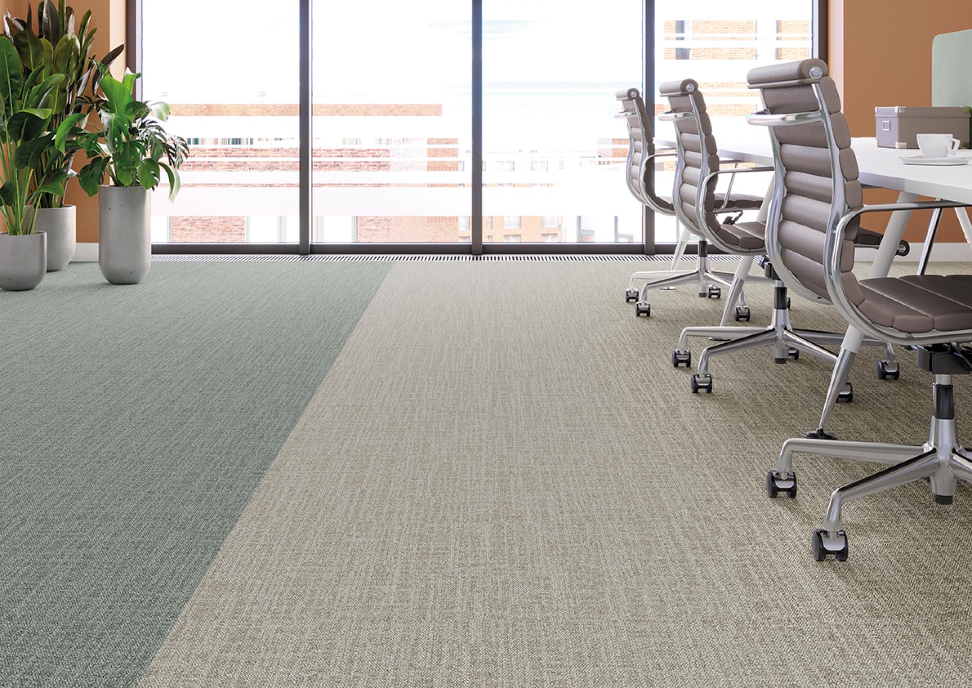 Modern office space featuring Forbo's Tessera Accord flooring in soft green and beige tones, enhancing productivity and balance.