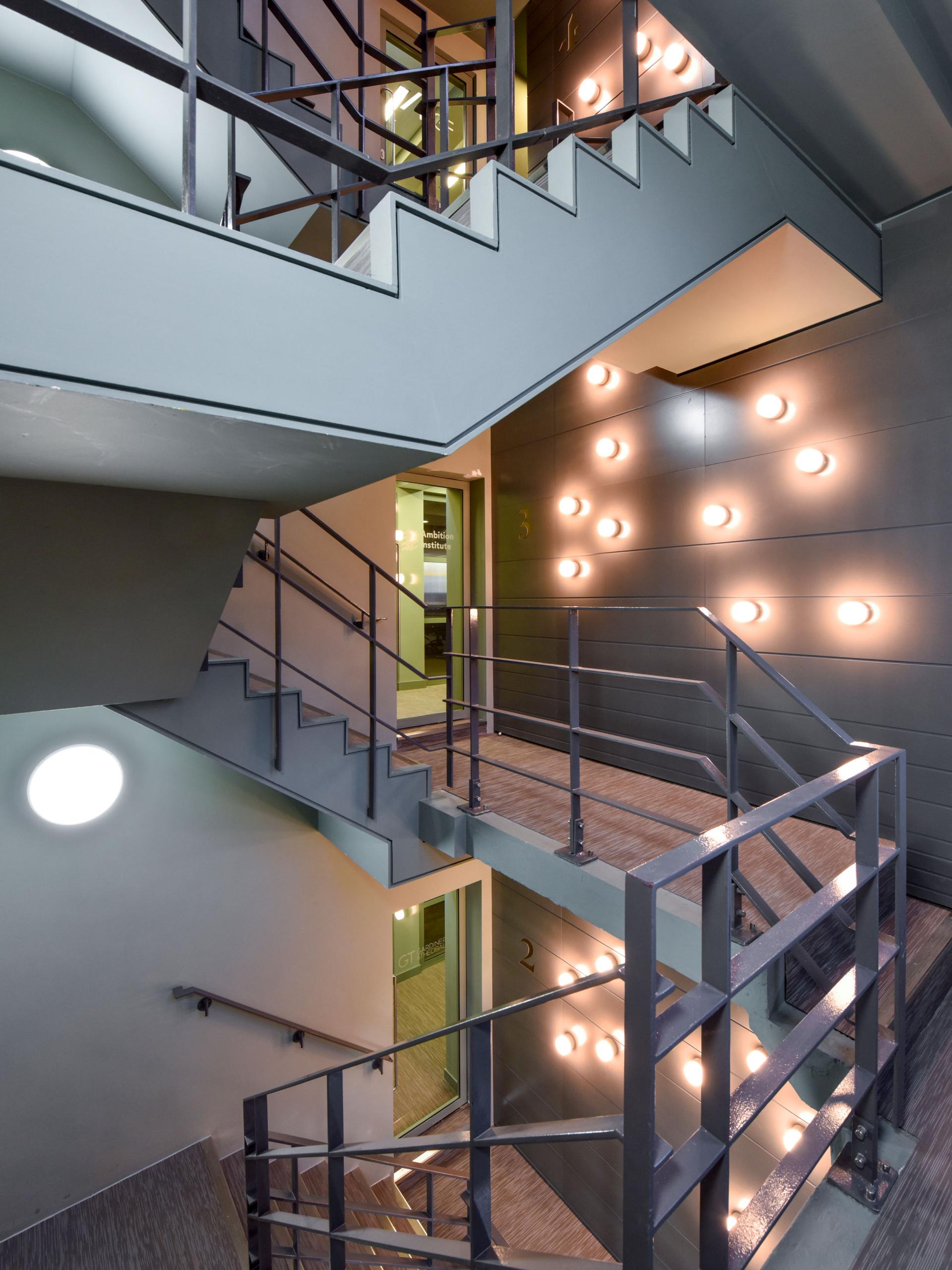 Contemporary staircase design featuring sleek lines, modern lighting, and a blend of functionality and aesthetics.
